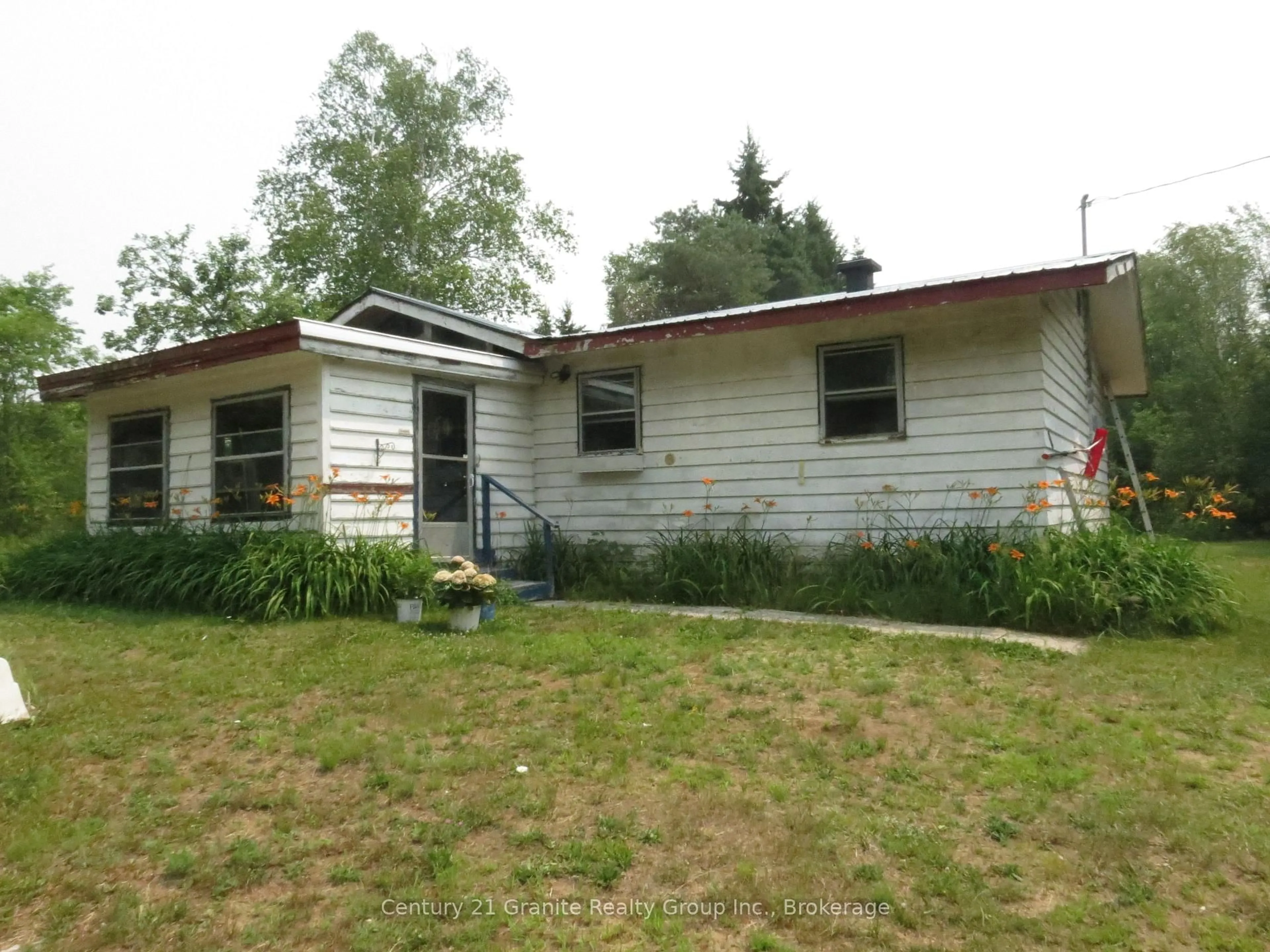 Home with vinyl exterior material, building for 1060 Buttercup Dr, Highlands East Ontario K0L 3C0