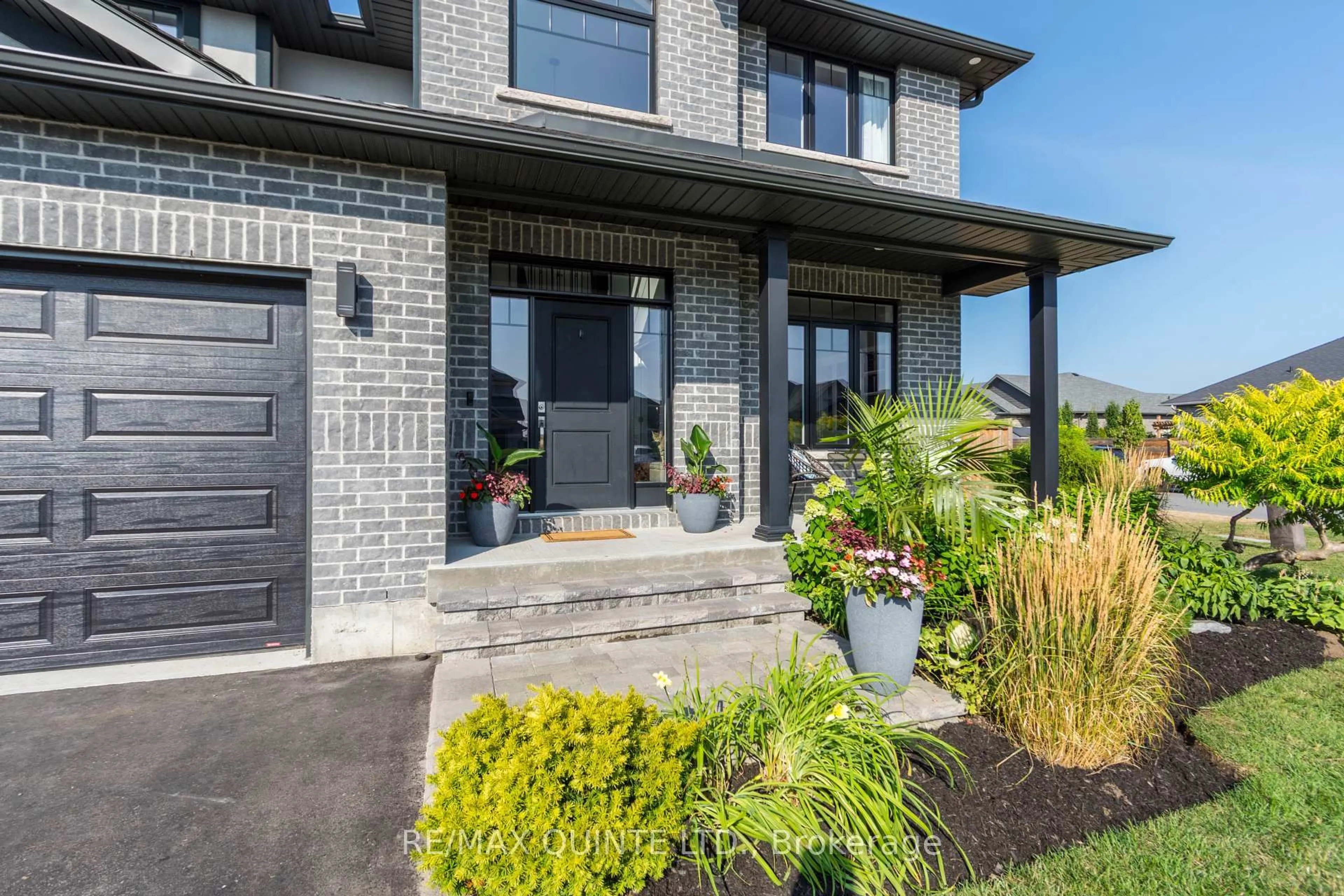 Home with brick exterior material, street for 104 Hampton Ridge Dr, Belleville Ontario K8N 0E6