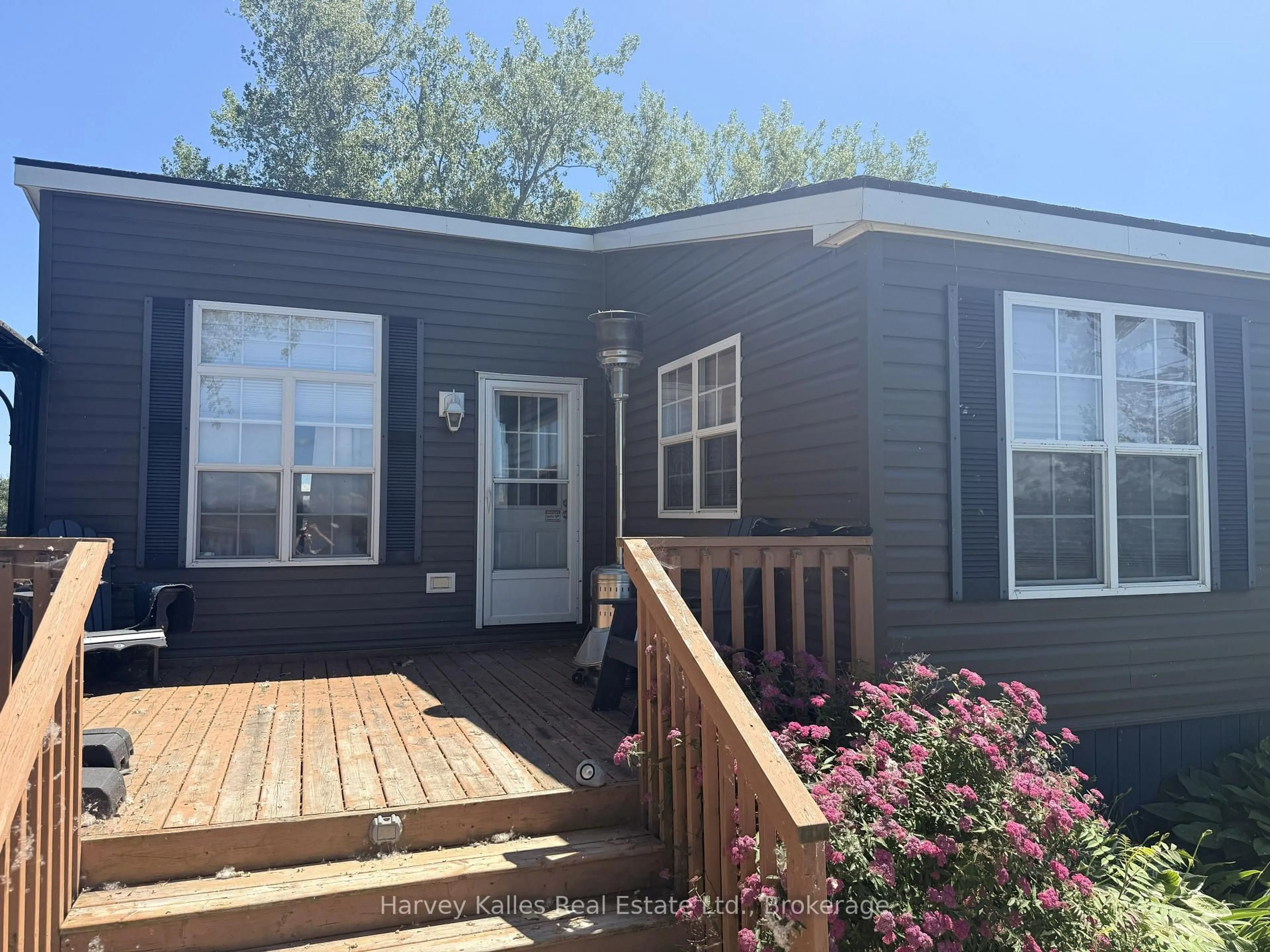 Home with vinyl exterior material, street for 486 County Rd 18, 72 Cherry Beach Lane, Prince Edward County Ontario K0K 1P0