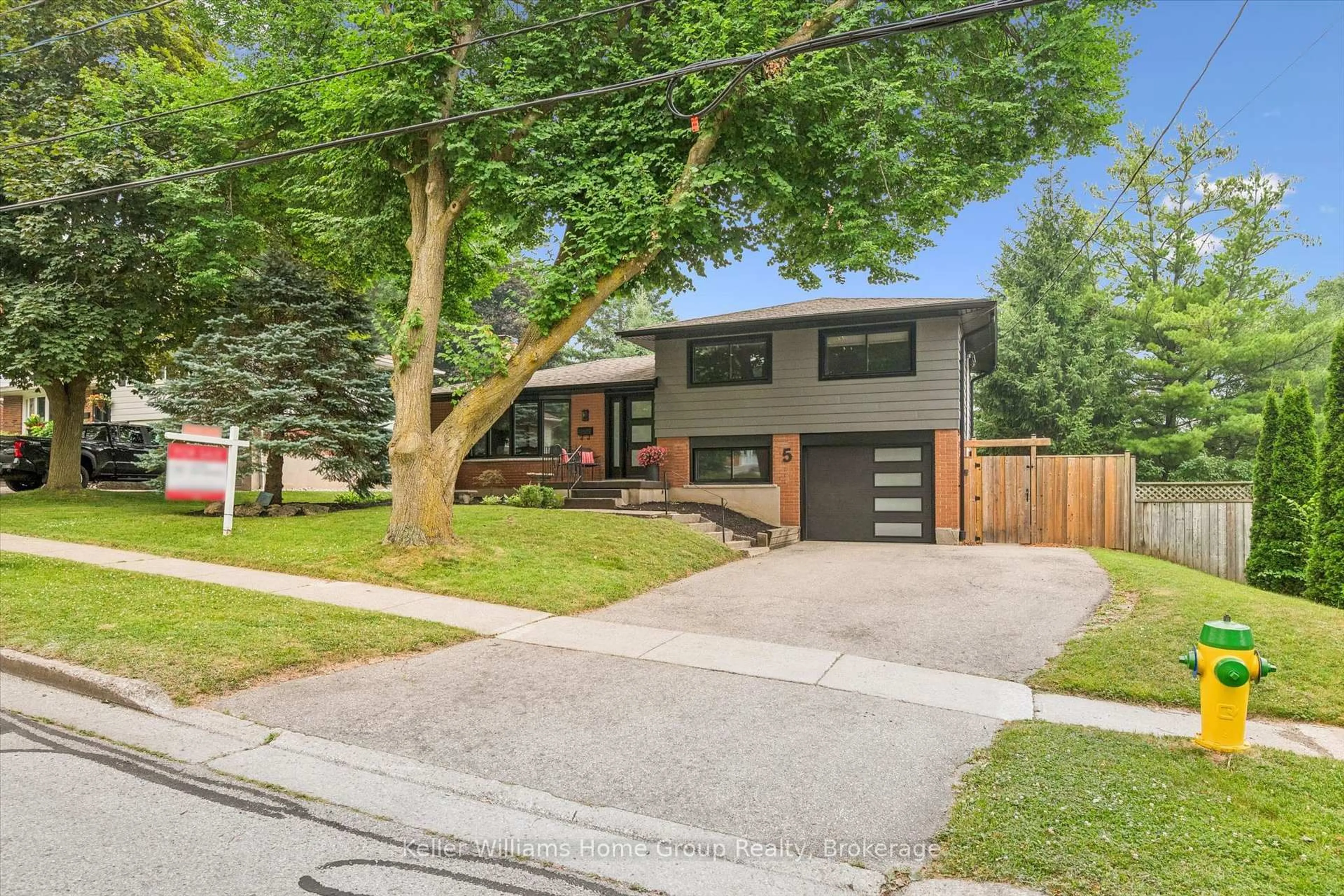 Home with brick exterior material, street for 5 Cheltonwood Ave, Guelph Ontario N1E 4E1