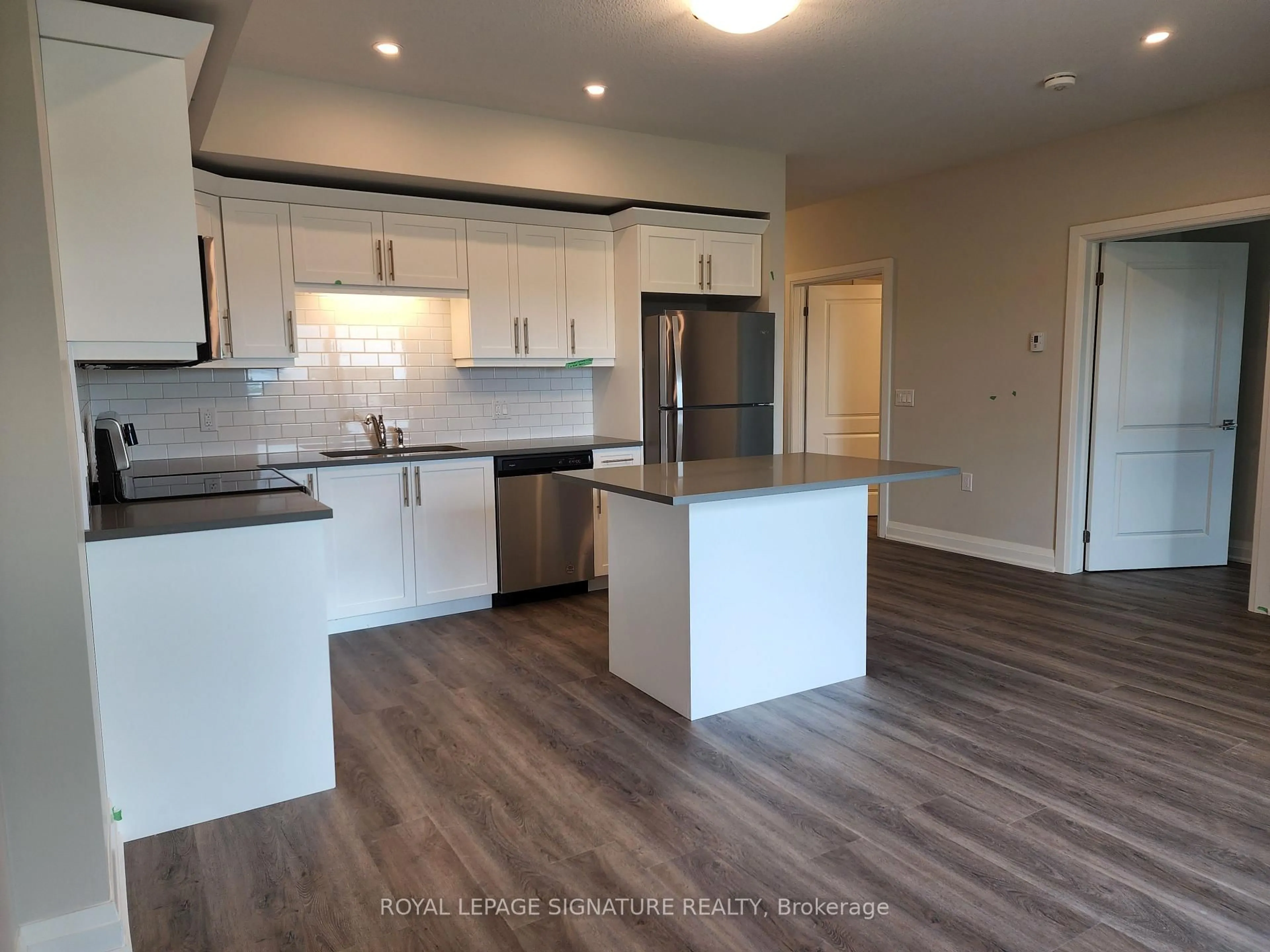Open concept kitchen, wood/laminate floor for 120 Summersides Blvd #312, Pelham Ontario L0S 1E1