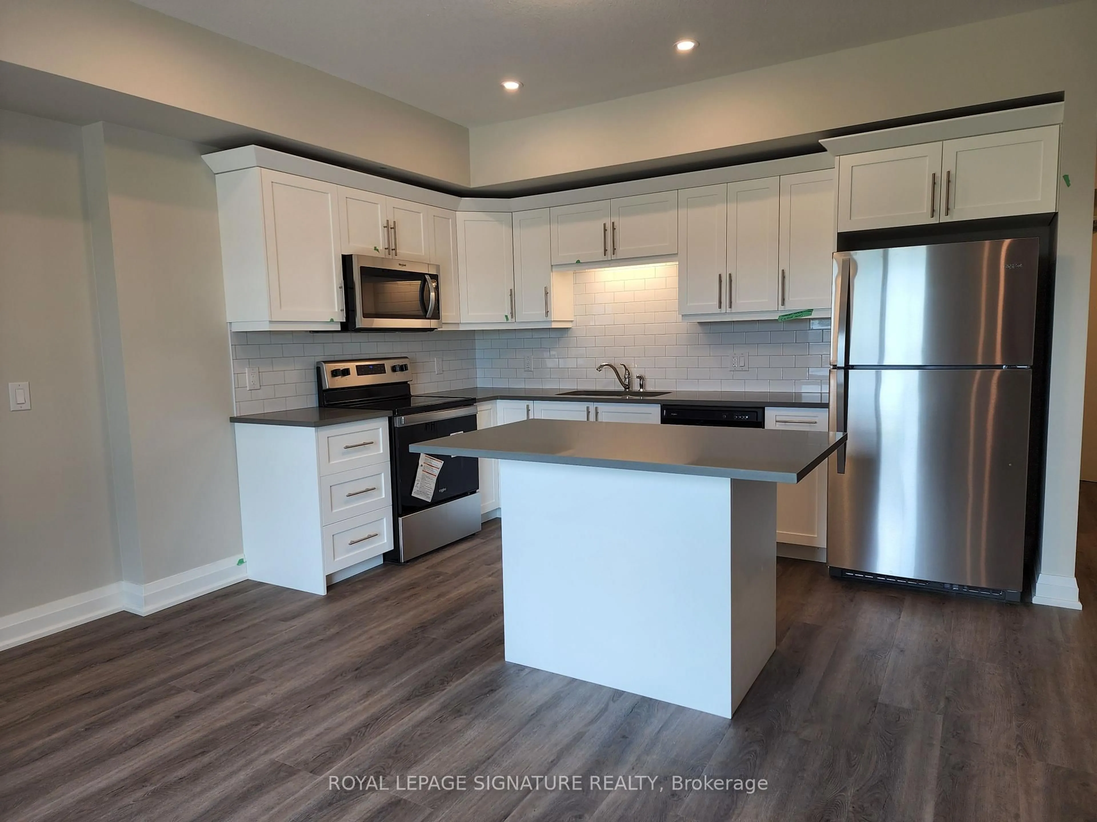 Open concept kitchen, wood/laminate floor for 120 Summersides Blvd #312, Pelham Ontario L0S 1E1