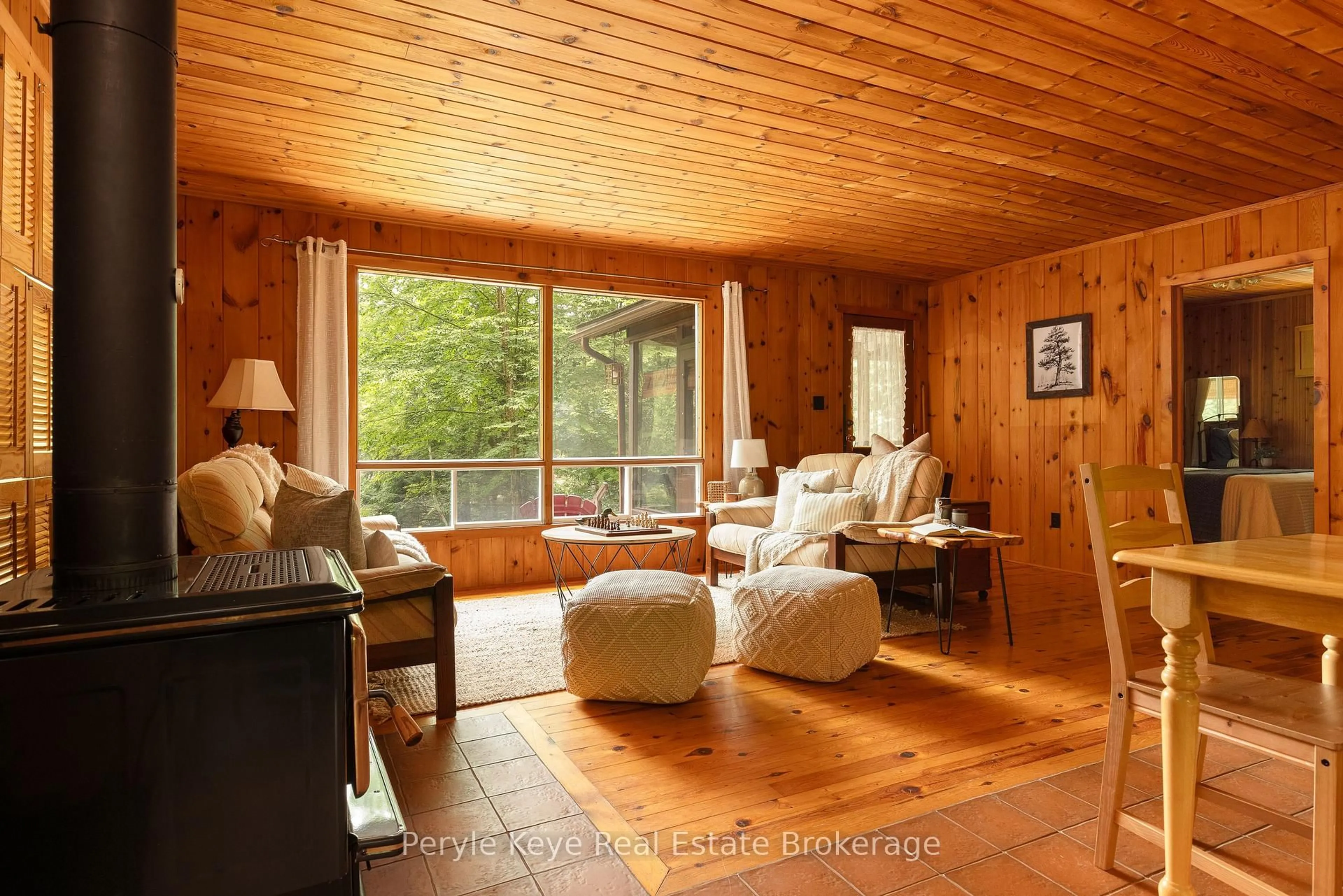 Living room with furniture, wood/laminate floor for 1057 H R S Rd, Bracebridge Ontario P1L 1X1
