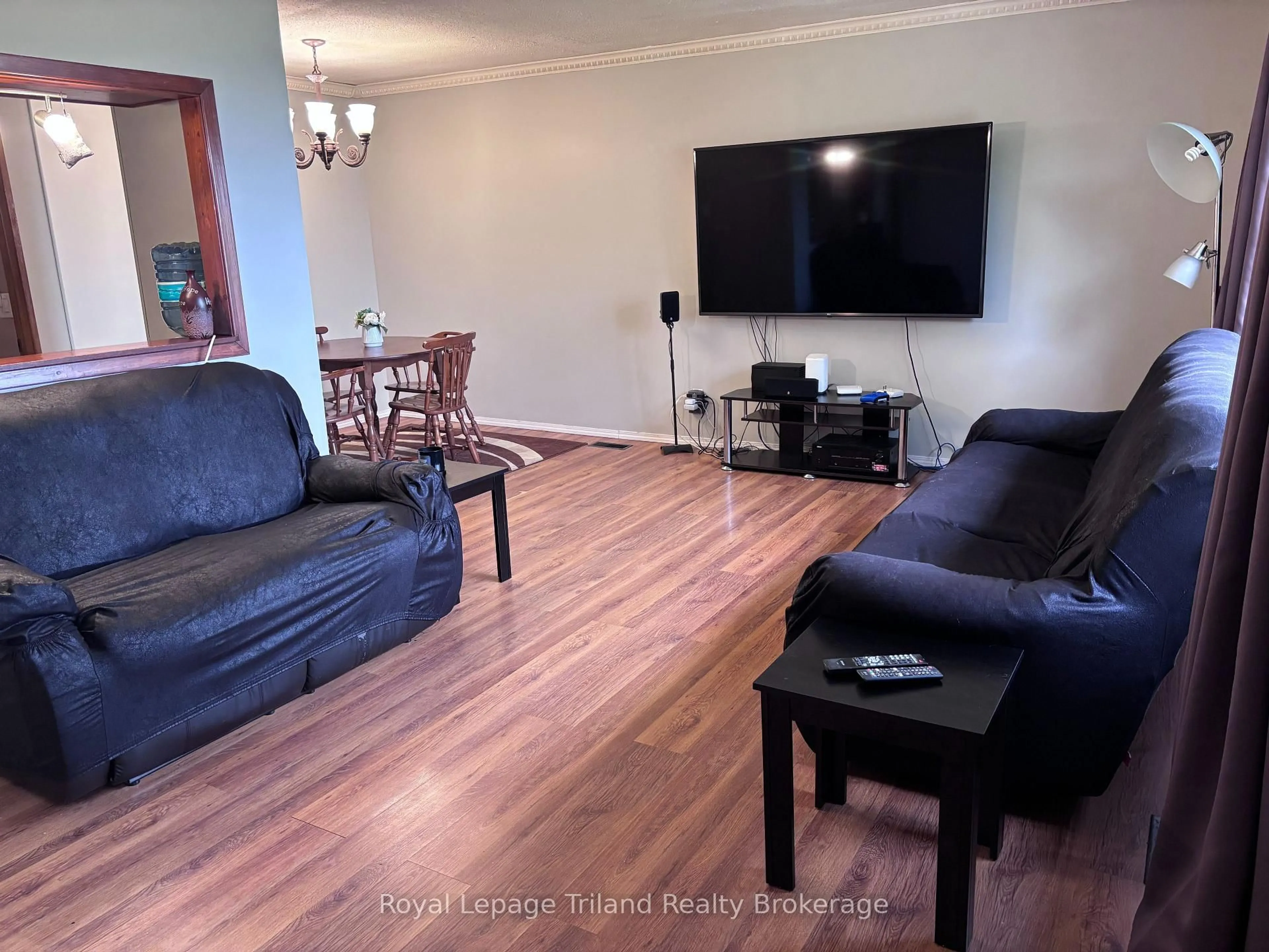 Living room with furniture, wood/laminate floor for 1776 Cockshutt Rd, Norfolk Ontario N0E 1Y0