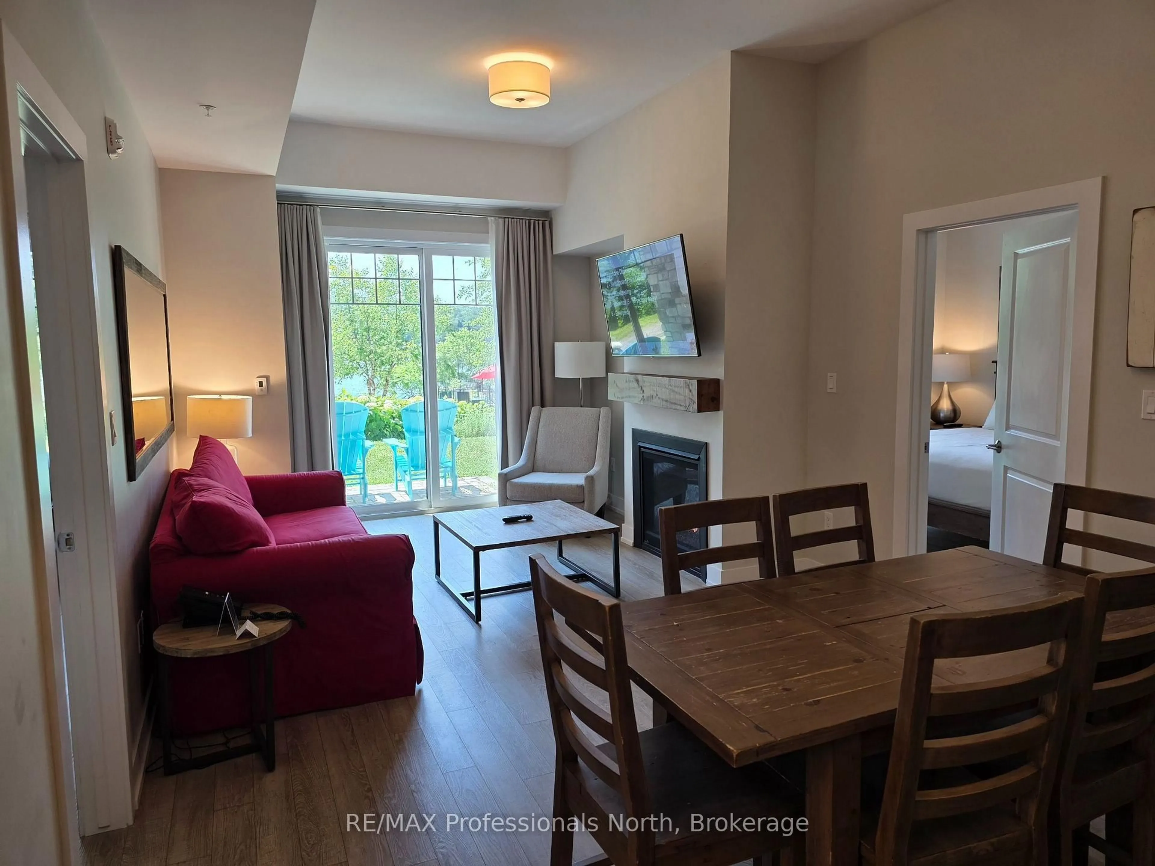 Living room with furniture, wood/laminate floor for 25 Penn Lake Point Rd #017, Huntsville Ontario P1H 1A9