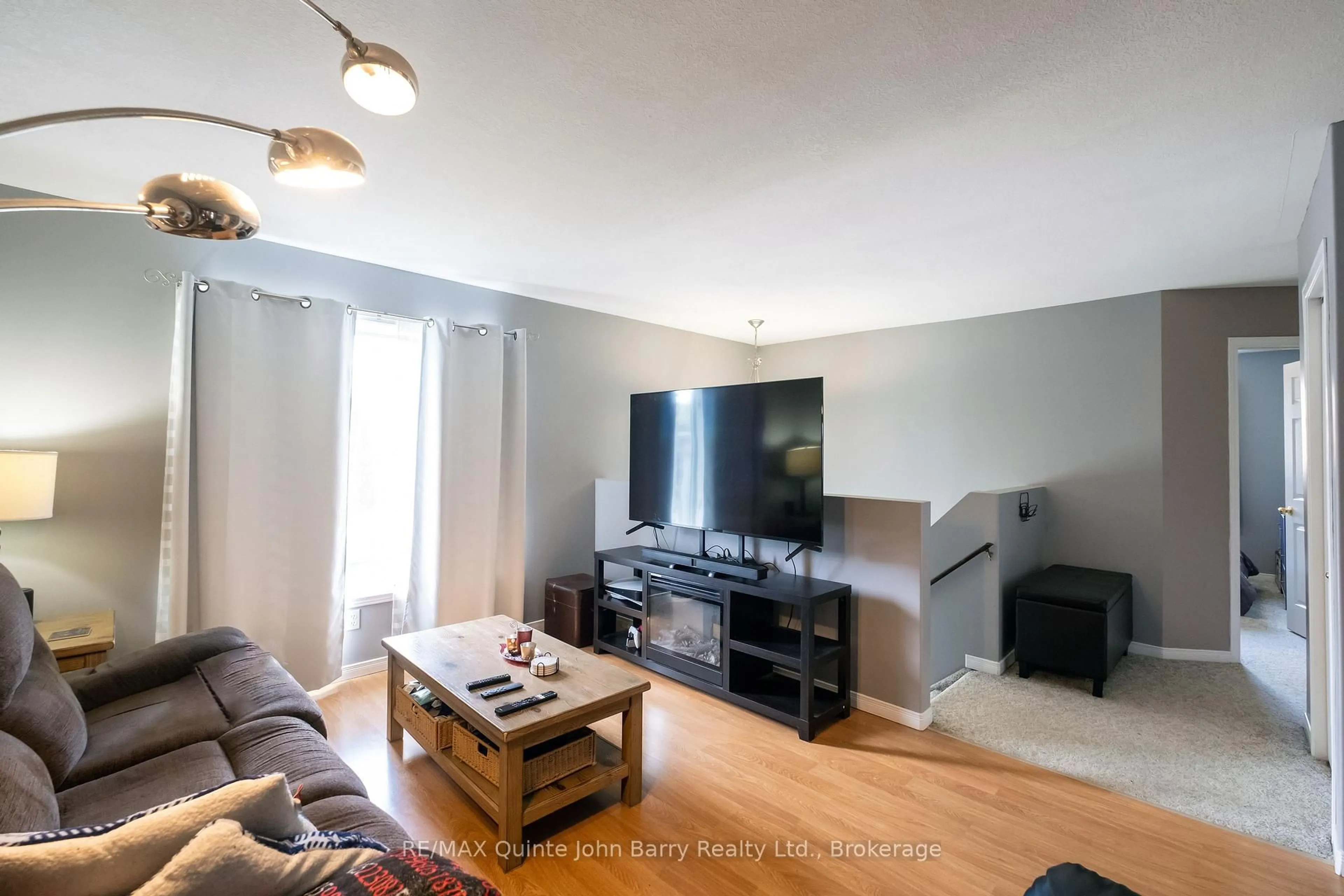Living room with furniture, wood/laminate floor for 152 Nicholas St, Quinte West Ontario K8V 6B2