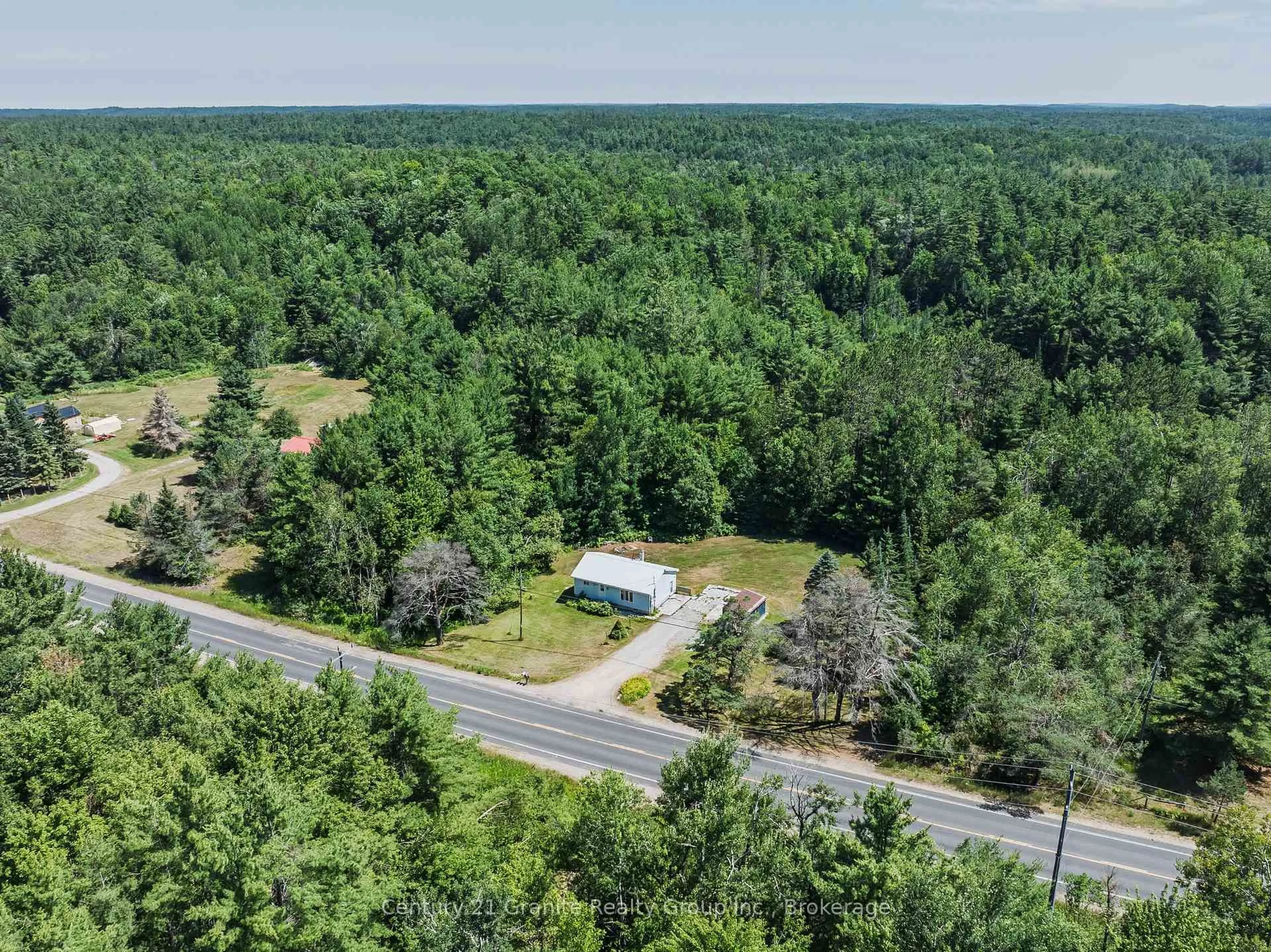 A pic from outside/outdoor area/front of a property/back of a property/a pic from drone, forest/trees view for 4750 County Road 121, Minden Hills Ontario K0M 2A1