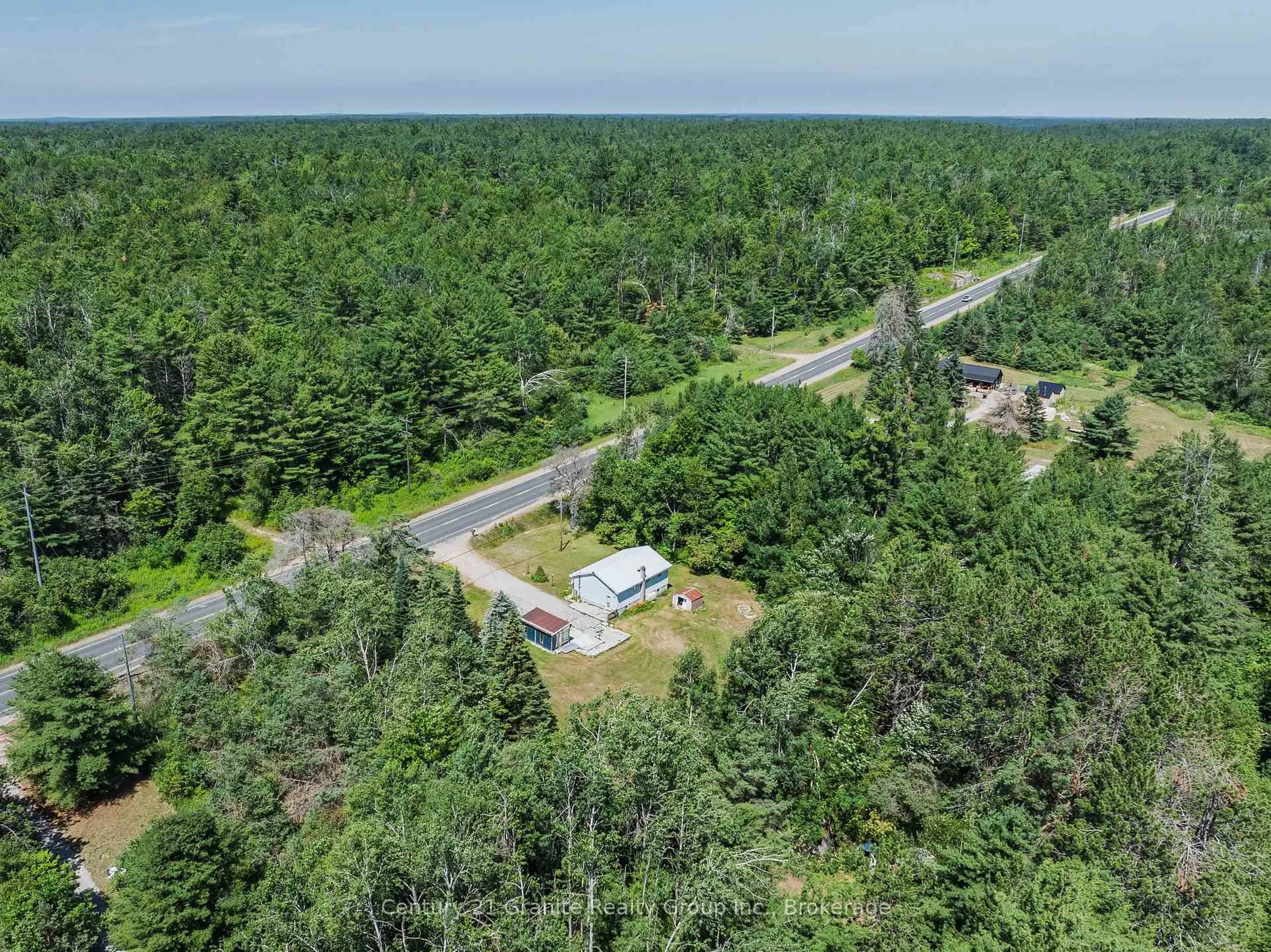 A pic from outside/outdoor area/front of a property/back of a property/a pic from drone, forest/trees view for 4750 County Road 121, Minden Hills Ontario K0M 2A1