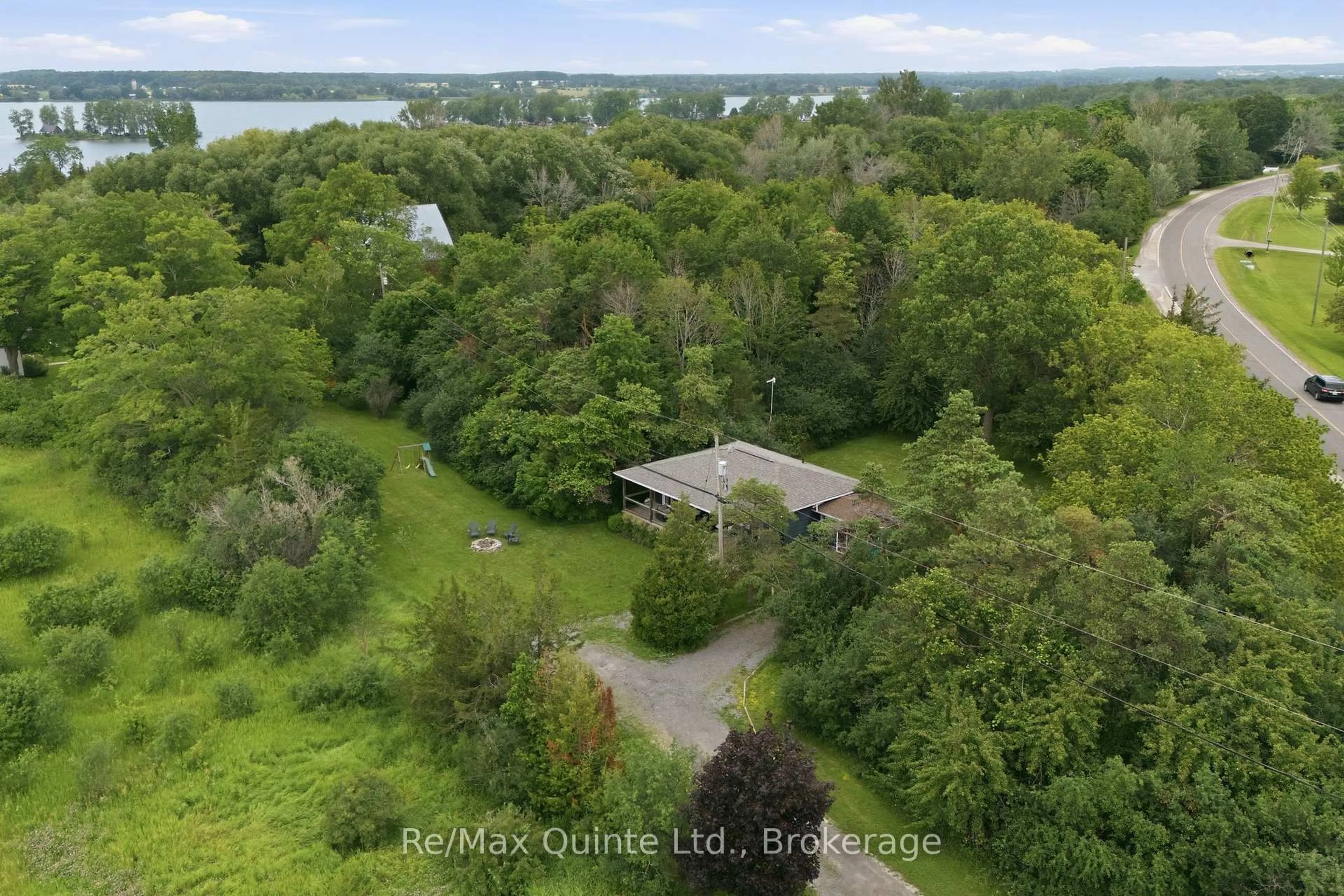 A pic from outside/outdoor area/front of a property/back of a property/a pic from drone, water/lake/river/ocean view for 6 Grays Lane, Prince Edward County Ontario K0K 1P0