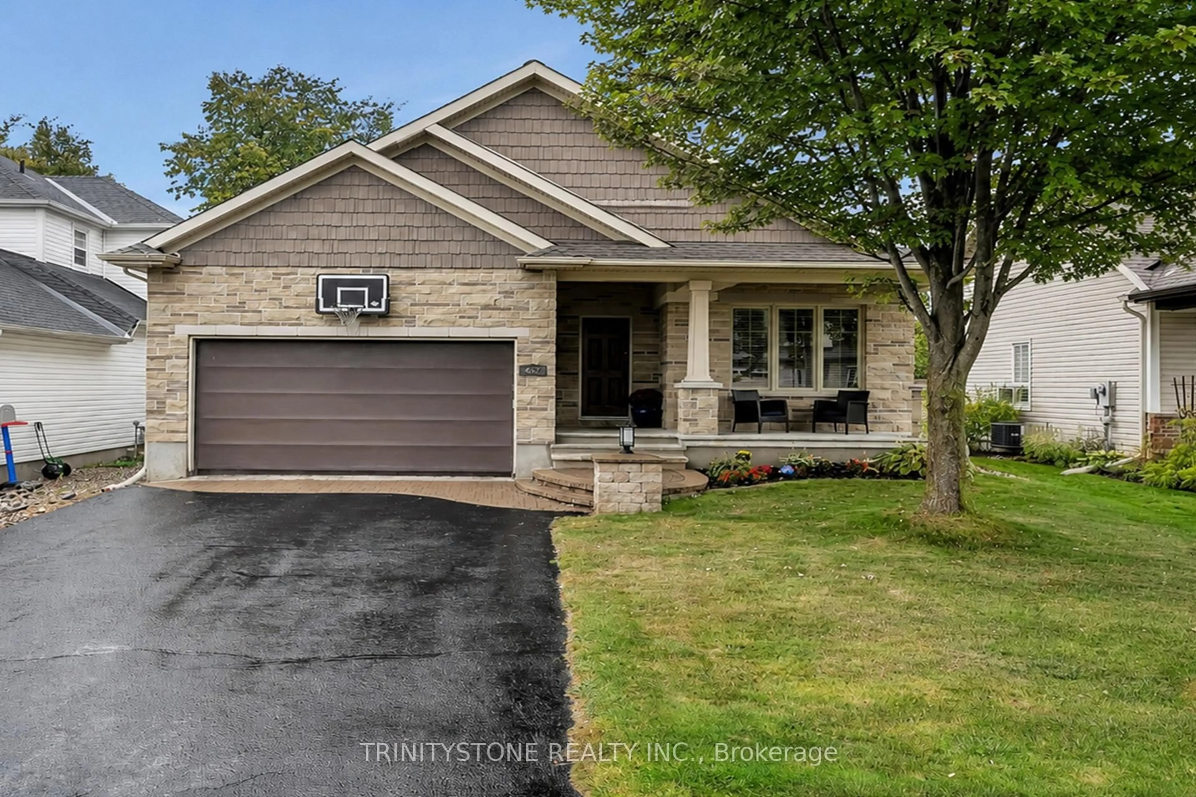 Home with brick exterior material, street for 452 Landswood Way, Ottawa Ontario K2S 0A4