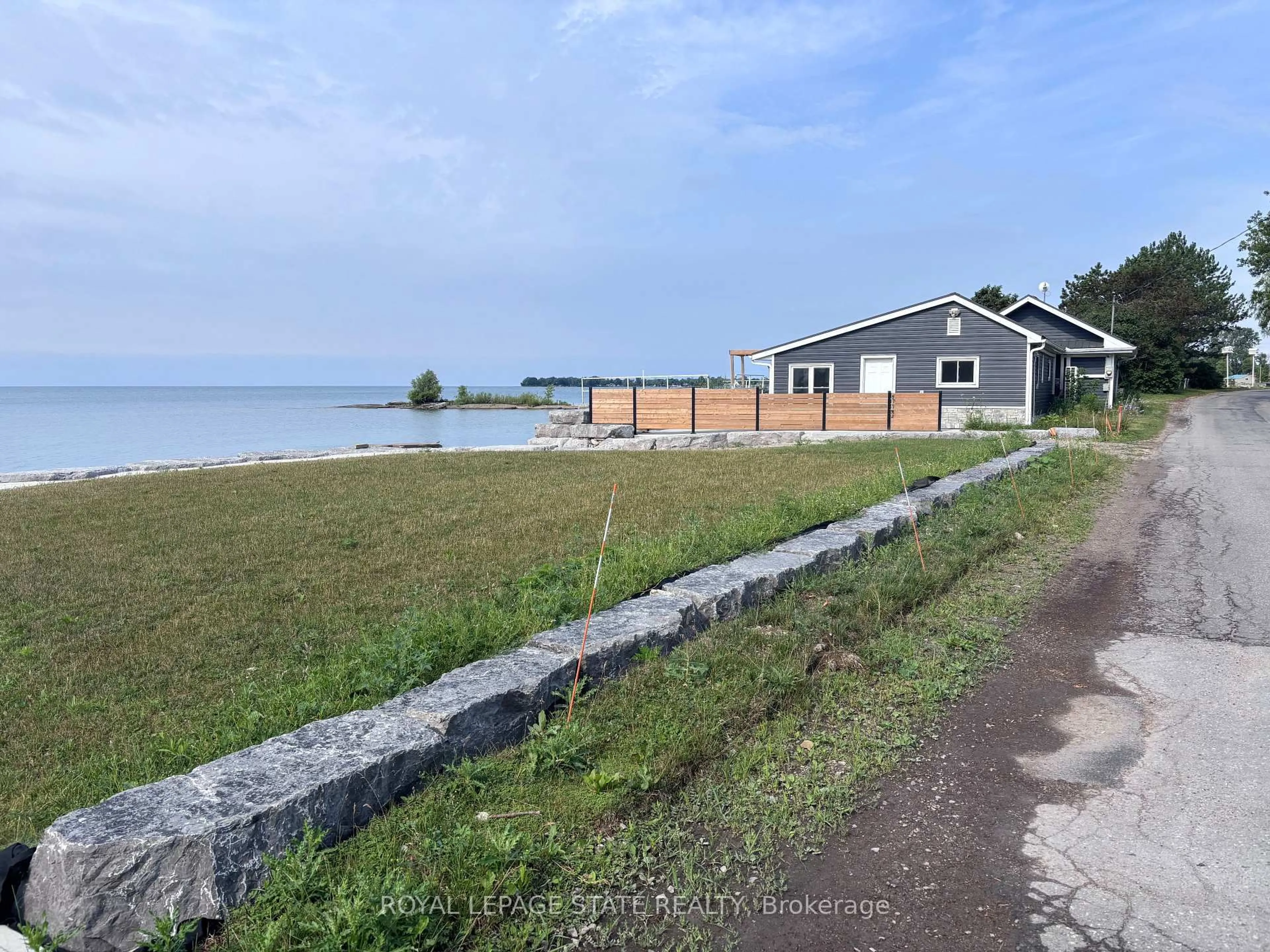 A pic from outside/outdoor area/front of a property/back of a property/a pic from drone, water/lake/river/ocean view for 1456 Lakeshore Rd, Haldimand Ontario N0A 1P0