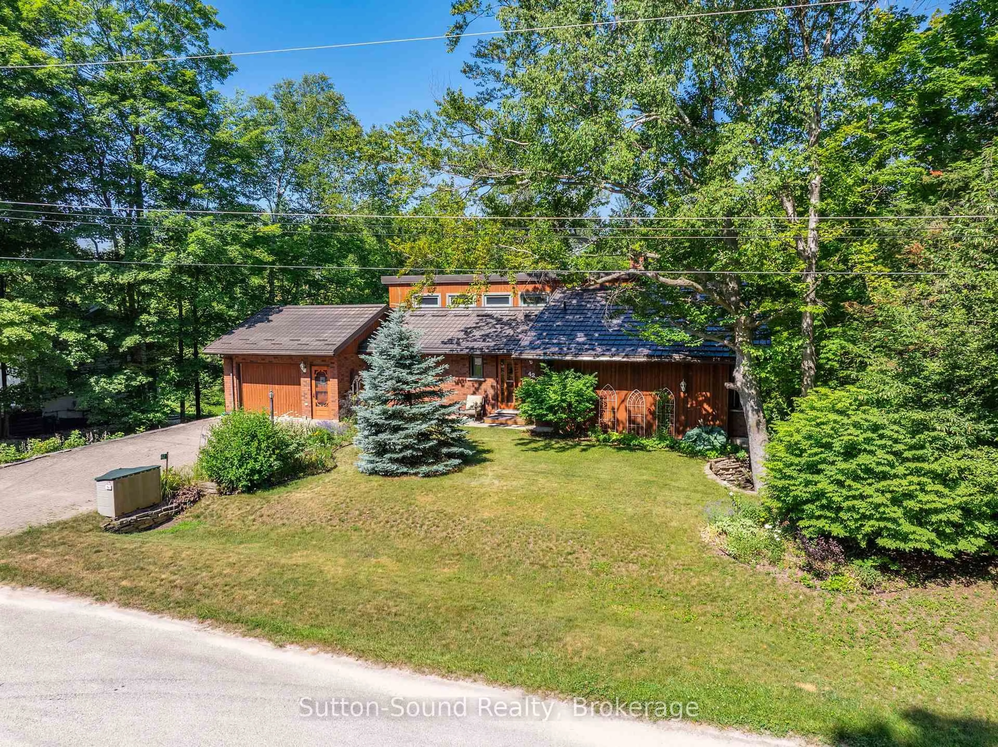 A pic from outside/outdoor area/front of a property/back of a property/a pic from drone, unknown for 42 CARSON LAKE Cres, South Bruce Peninsula Ontario N0H 2G0