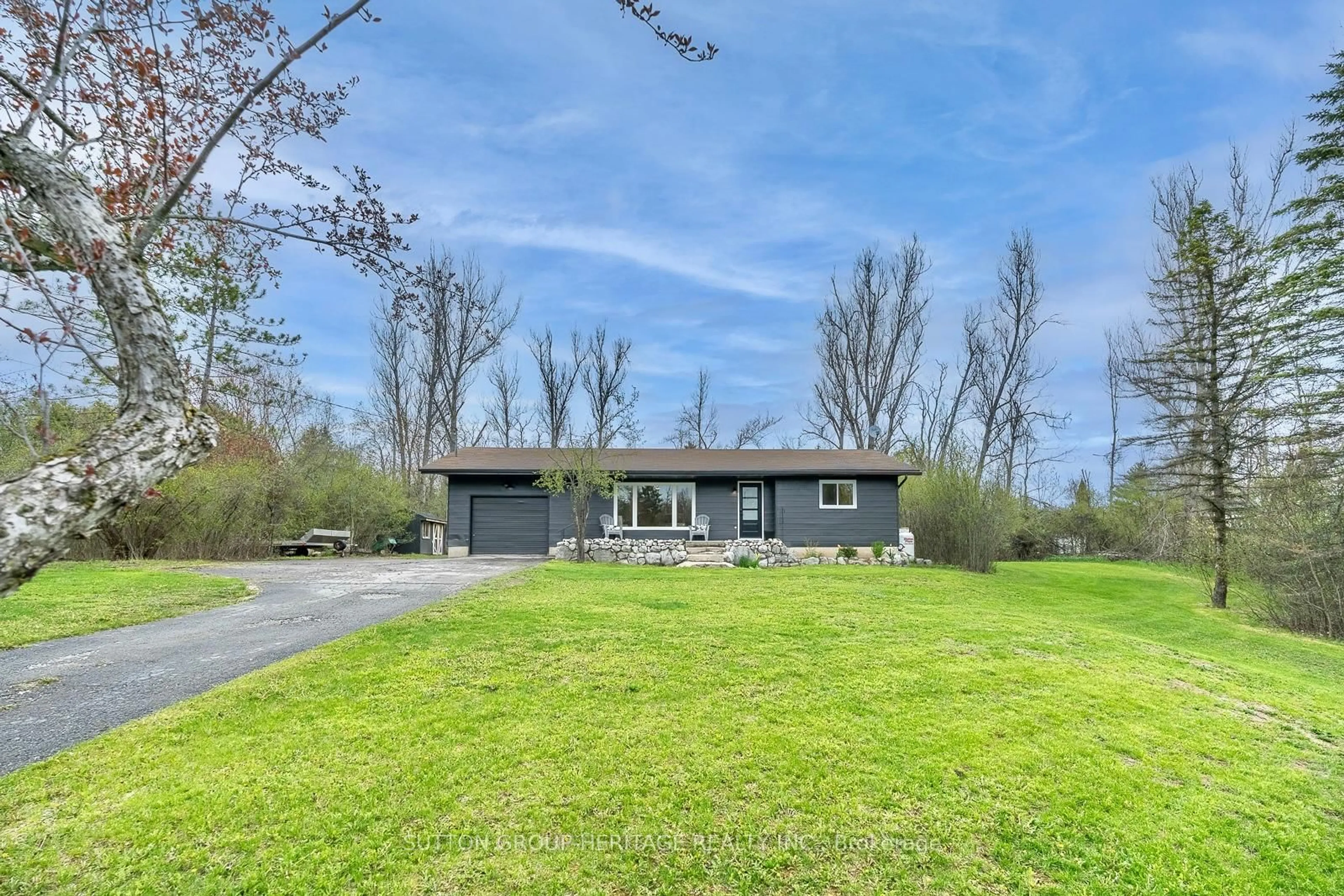 A pic from outside/outdoor area/front of a property/back of a property/a pic from drone, water/lake/river/ocean view for 11 Swiss Cres, Trent Lakes Ontario K0M 1A0
