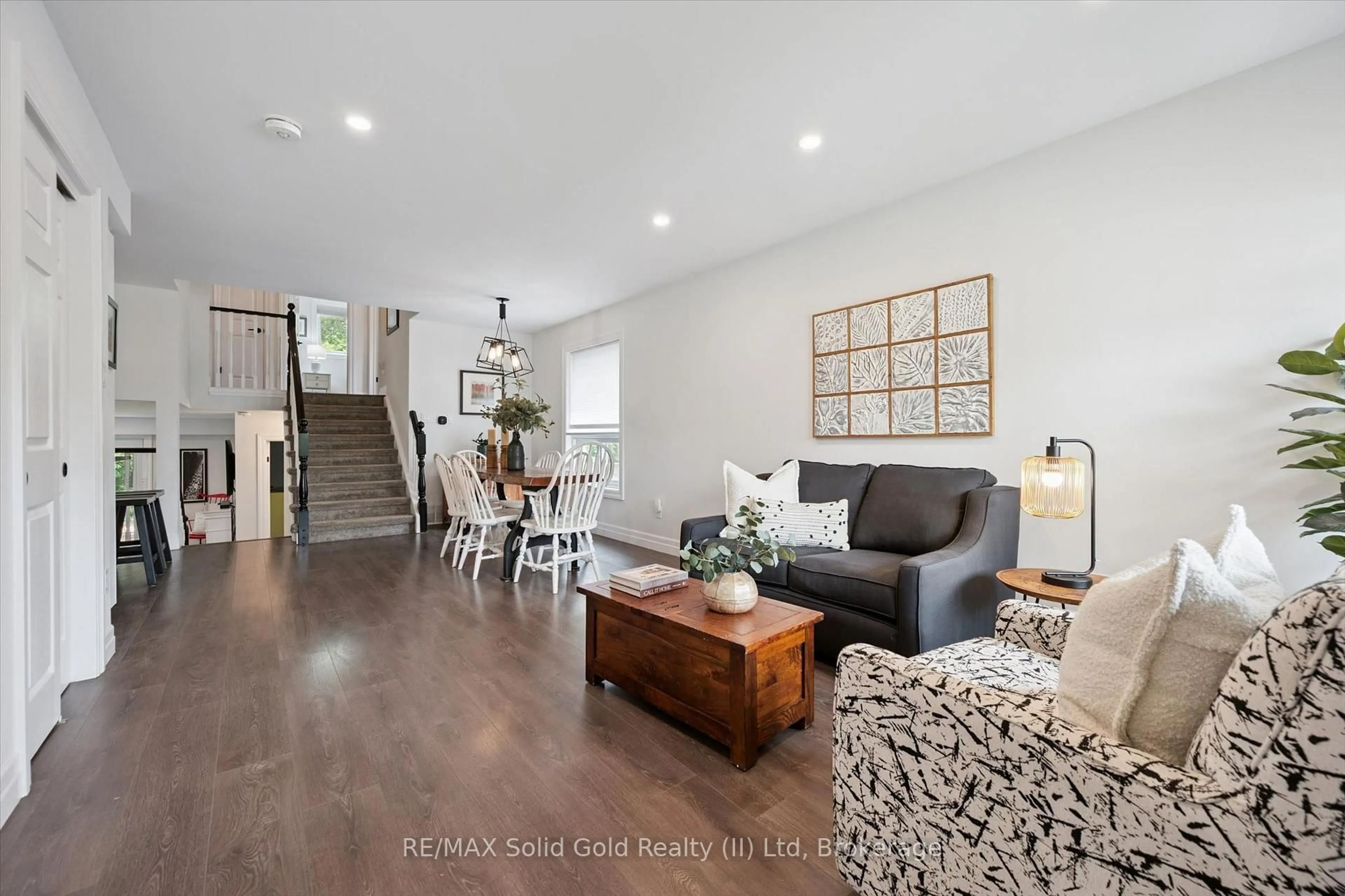 Living room with furniture, wood/laminate floor for 142 Marl Meadow Dr, Kitchener Ontario N2R 1L3