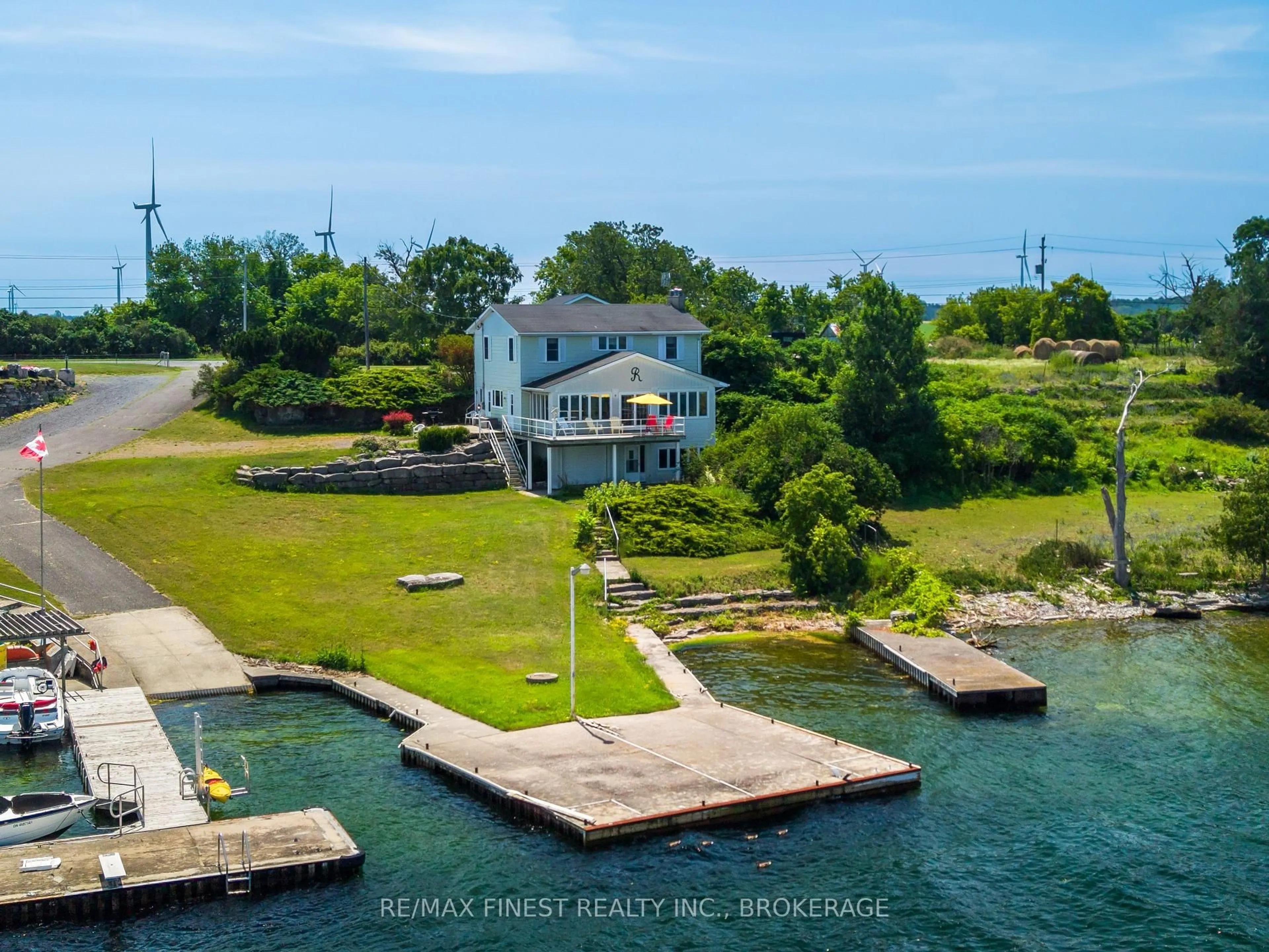 A pic from outside/outdoor area/front of a property/back of a property/a pic from drone, water/lake/river/ocean view for 396 HIGHWAY 96, Wolfe Island Ontario K0H 2Y0