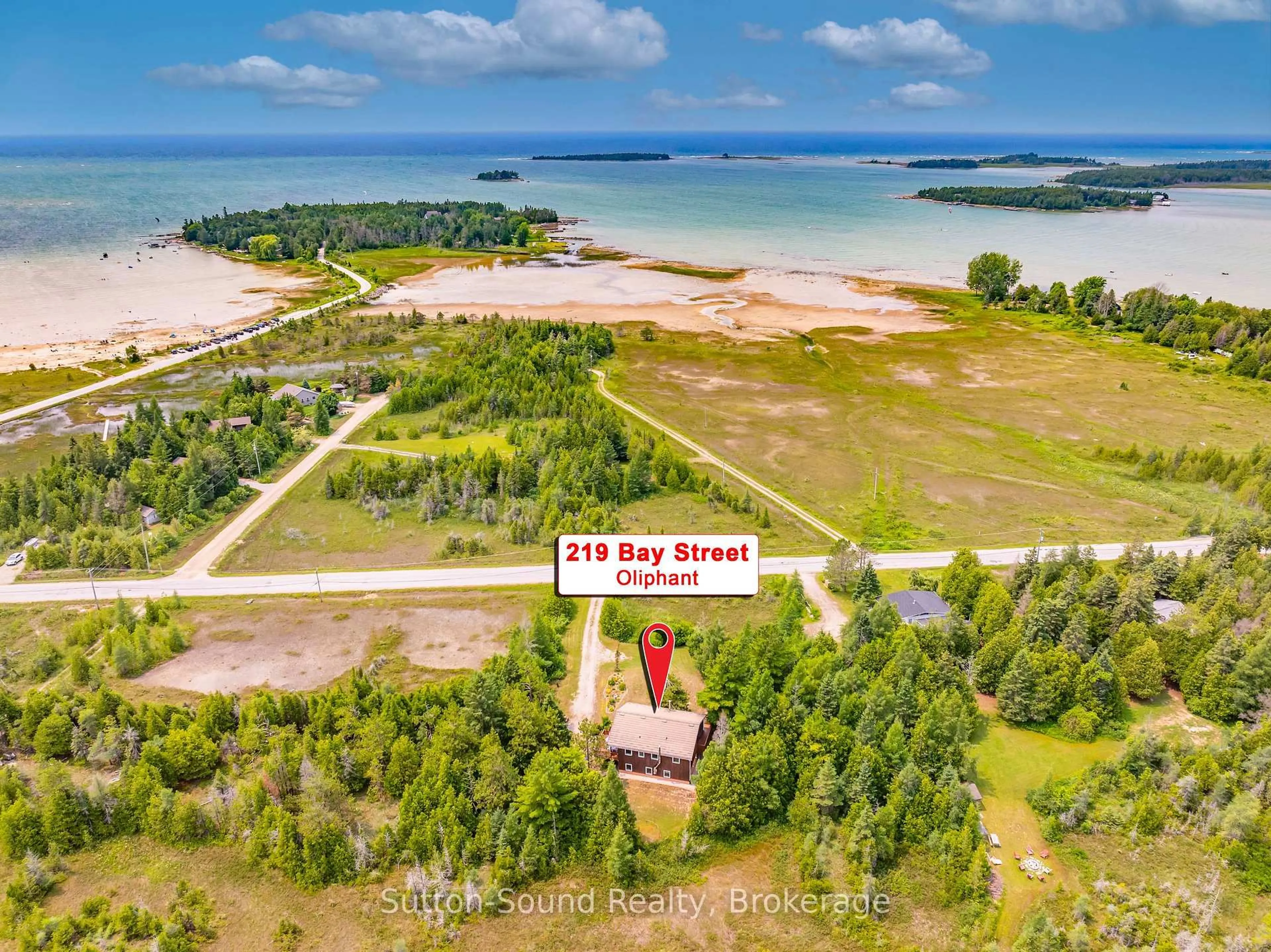 A pic from outside/outdoor area/front of a property/back of a property/a pic from drone, water/lake/river/ocean view for 219 Bay St. St, South Bruce Peninsula Ontario N0H 2T0