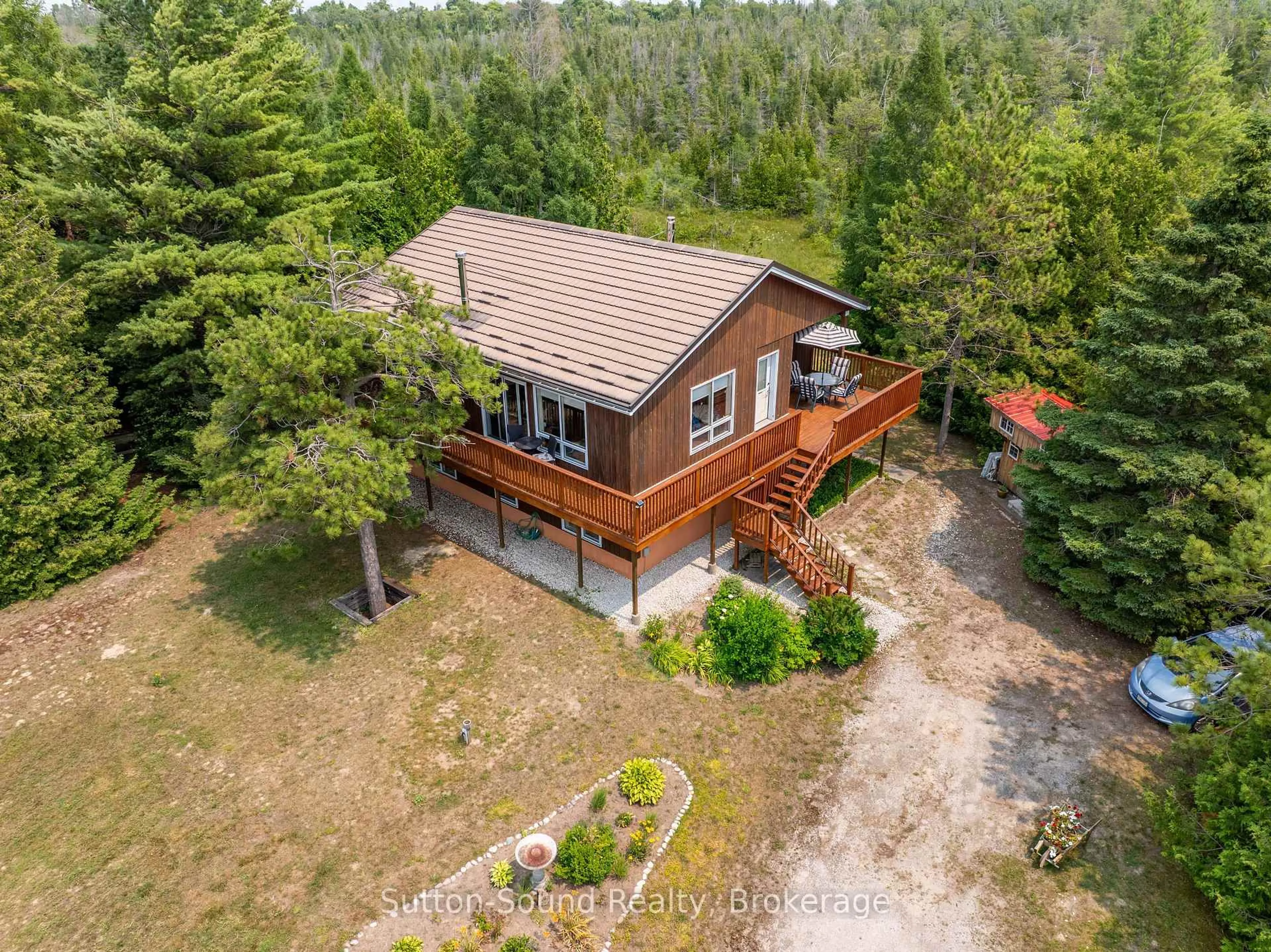 A pic from outside/outdoor area/front of a property/back of a property/a pic from drone, forest/trees view for 219 Bay St. St, South Bruce Peninsula Ontario N0H 2T0