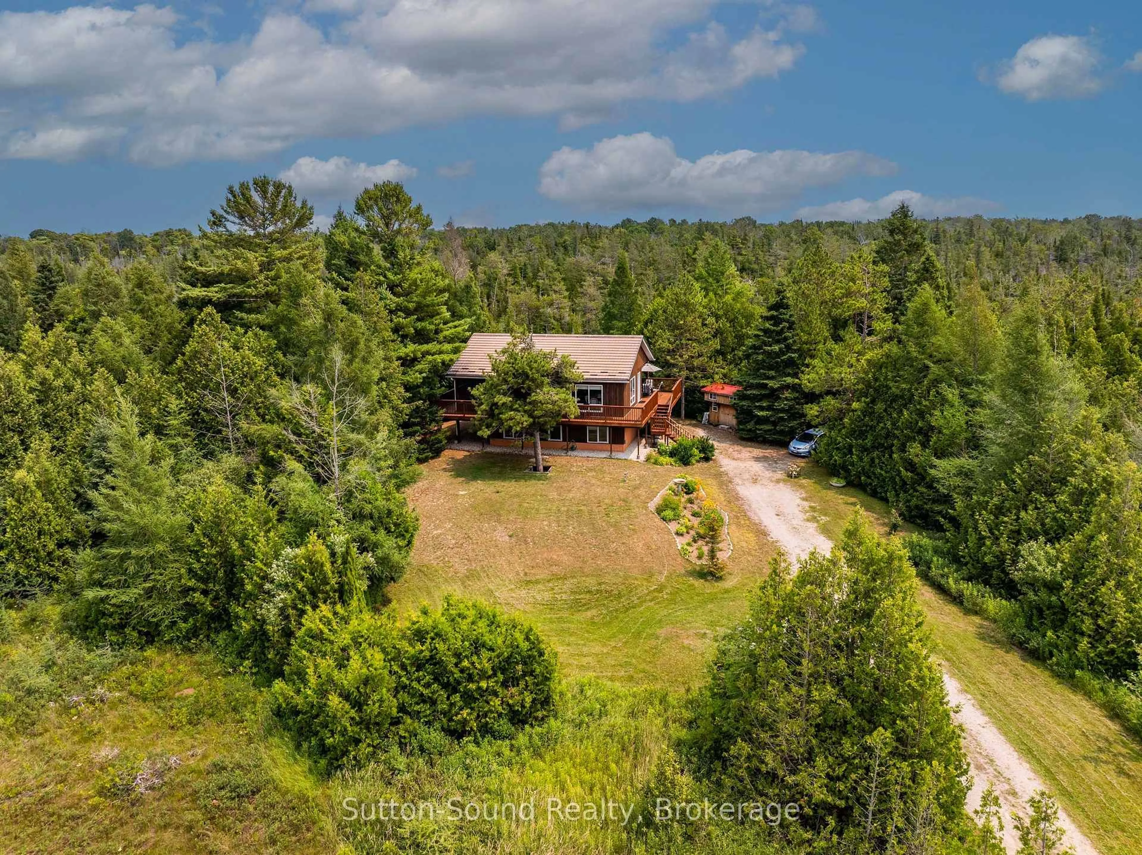 A pic from outside/outdoor area/front of a property/back of a property/a pic from drone, forest/trees view for 219 Bay St. St, South Bruce Peninsula Ontario N0H 2T0