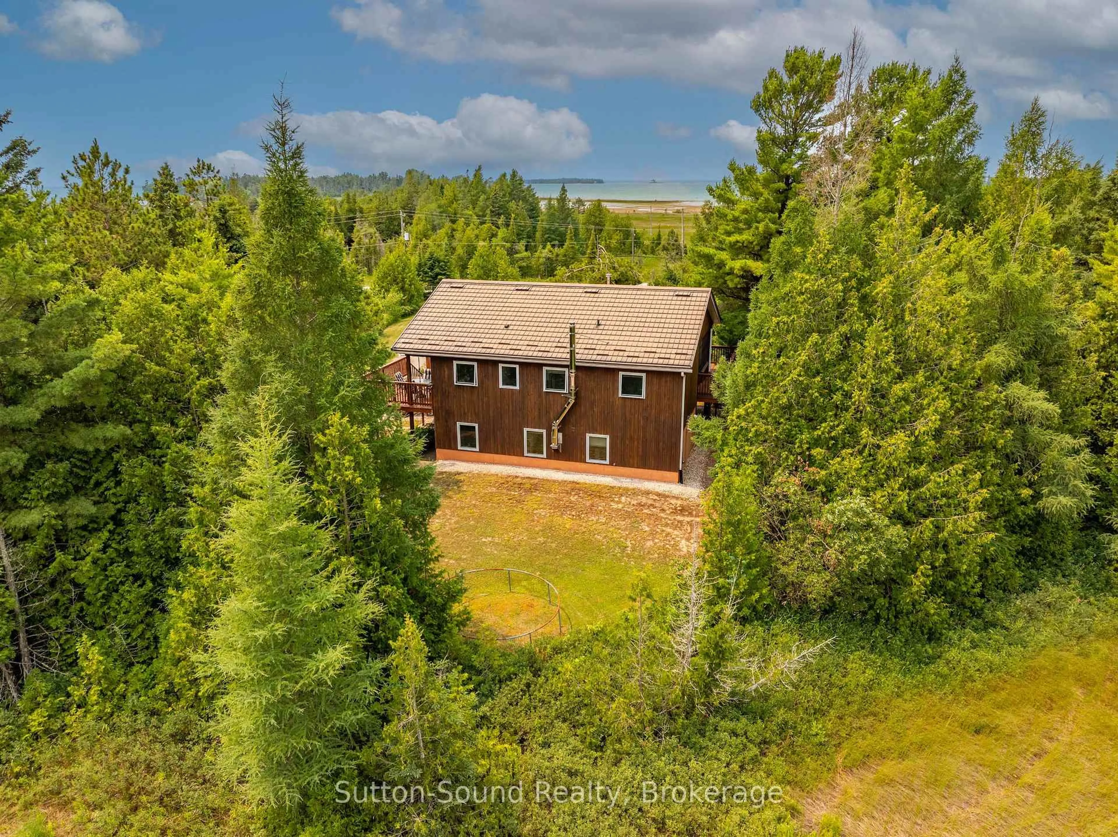A pic from outside/outdoor area/front of a property/back of a property/a pic from drone, forest/trees view for 219 Bay St. St, South Bruce Peninsula Ontario N0H 2T0