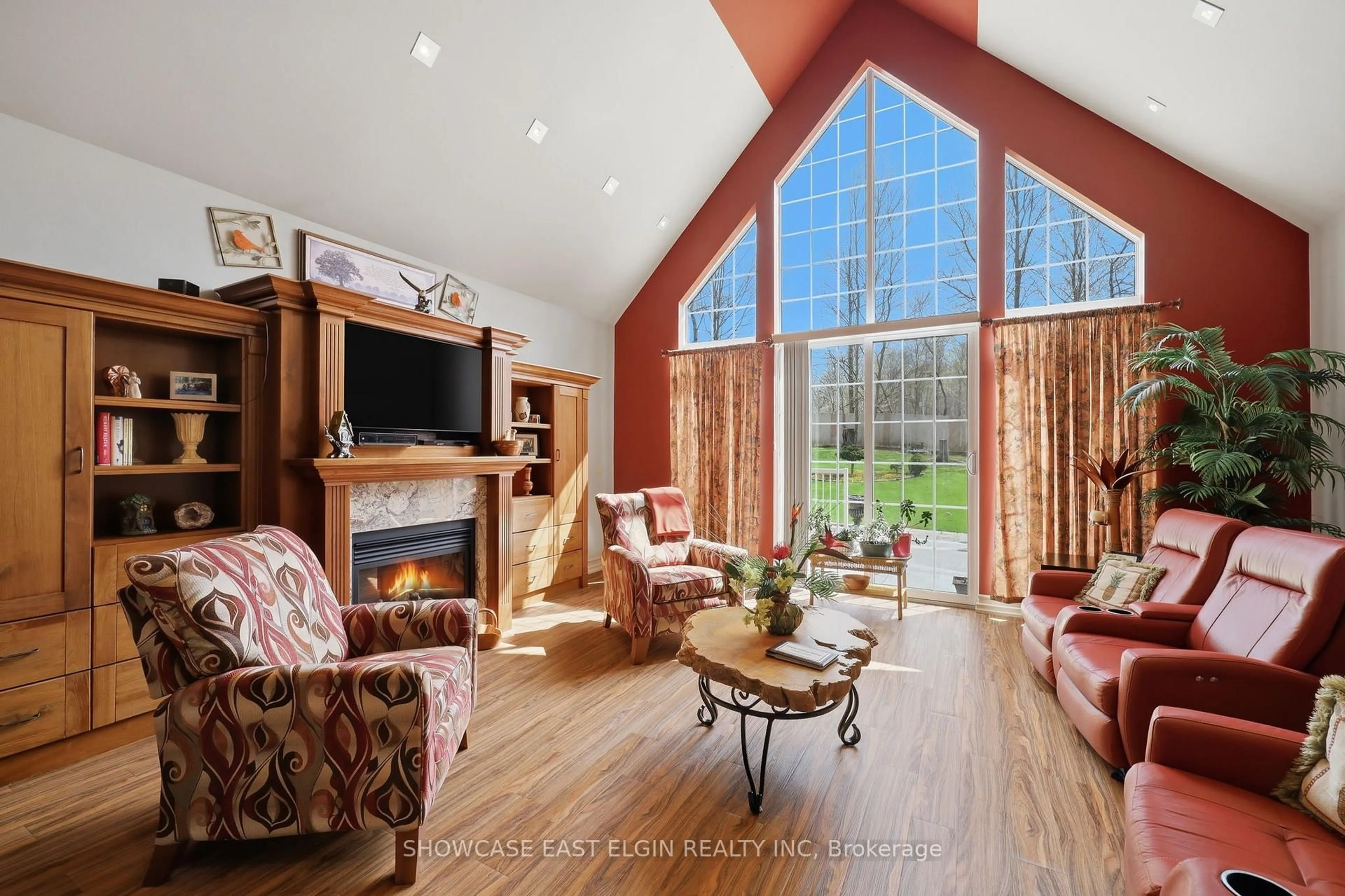 Living room with furniture, wood/laminate floor for 88628 Hilltop Lane, Malahide Ontario N5H 0B1
