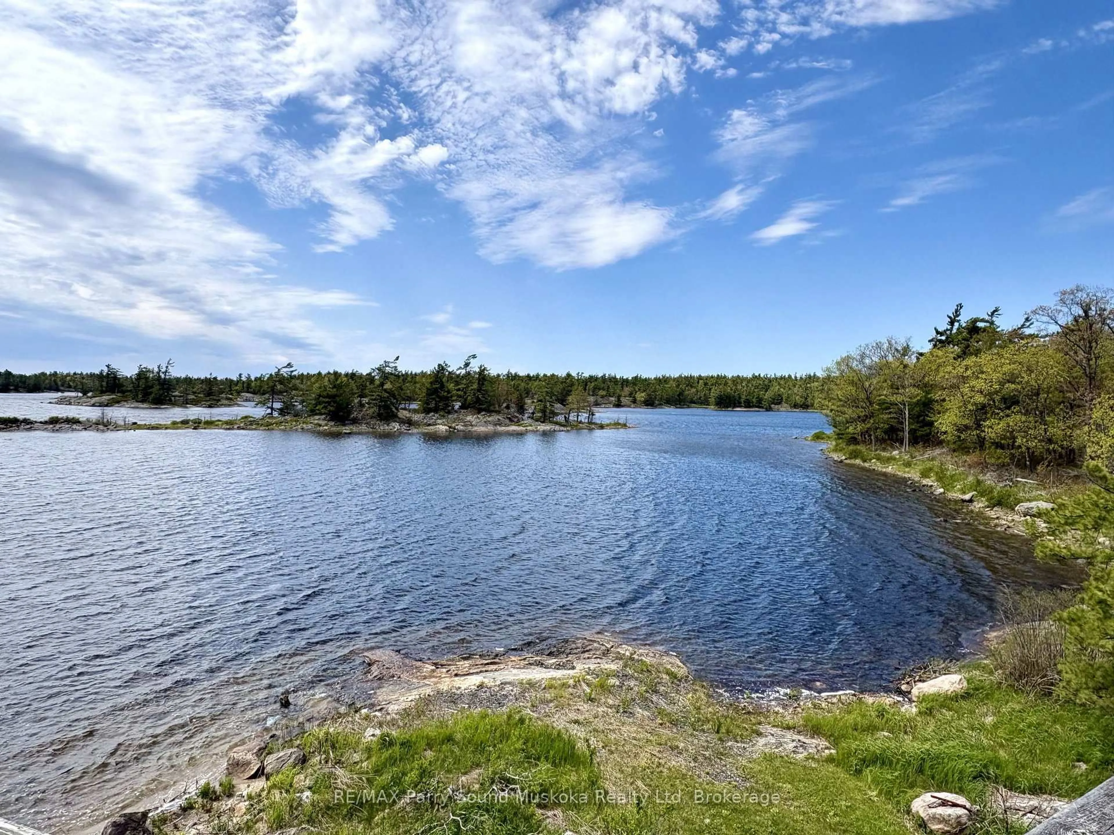 A pic from outside/outdoor area/front of a property/back of a property/a pic from drone, water/lake/river/ocean view for 16 B55 Island, The Archipelago Ontario P0C 1H0