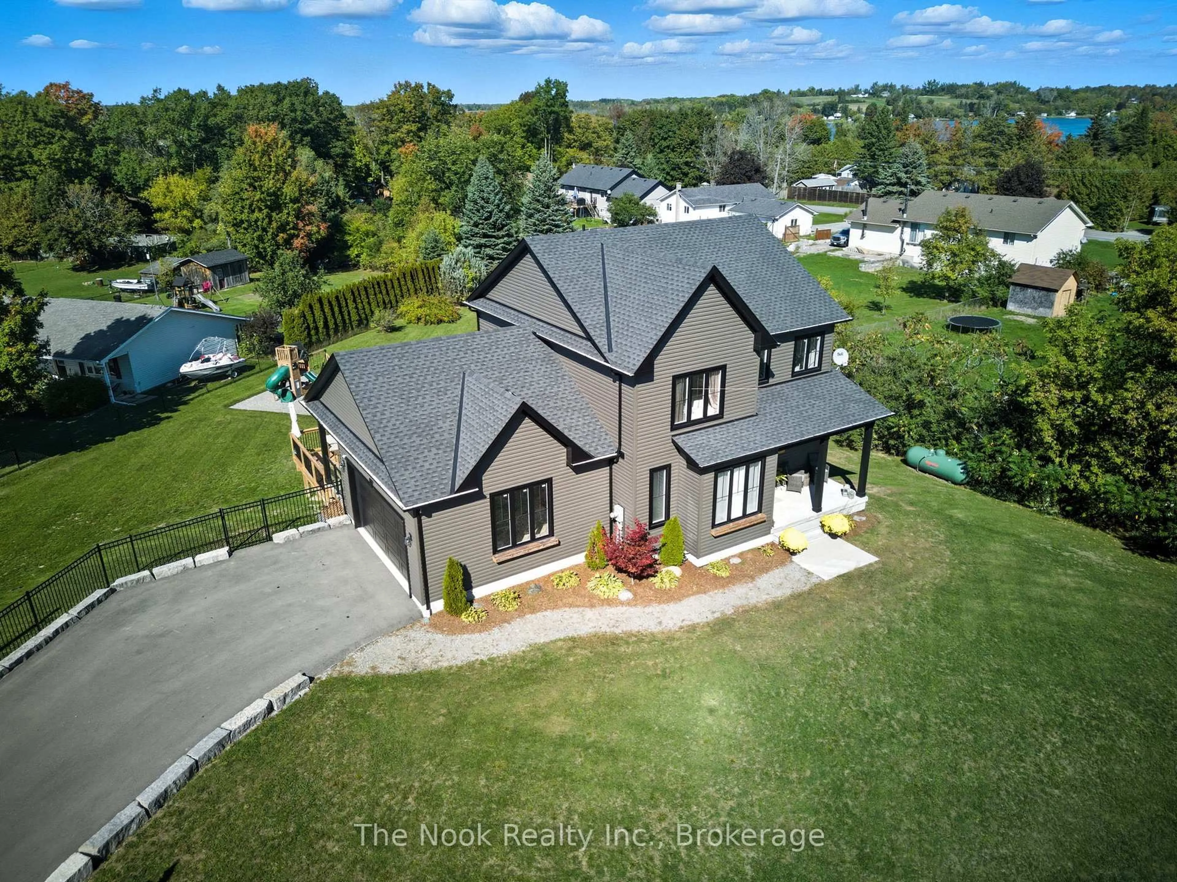 A pic from outside/outdoor area/front of a property/back of a property/a pic from drone, water/lake/river/ocean view for 39 Helen Cres, Kawartha Lakes Ontario K0M 2C0
