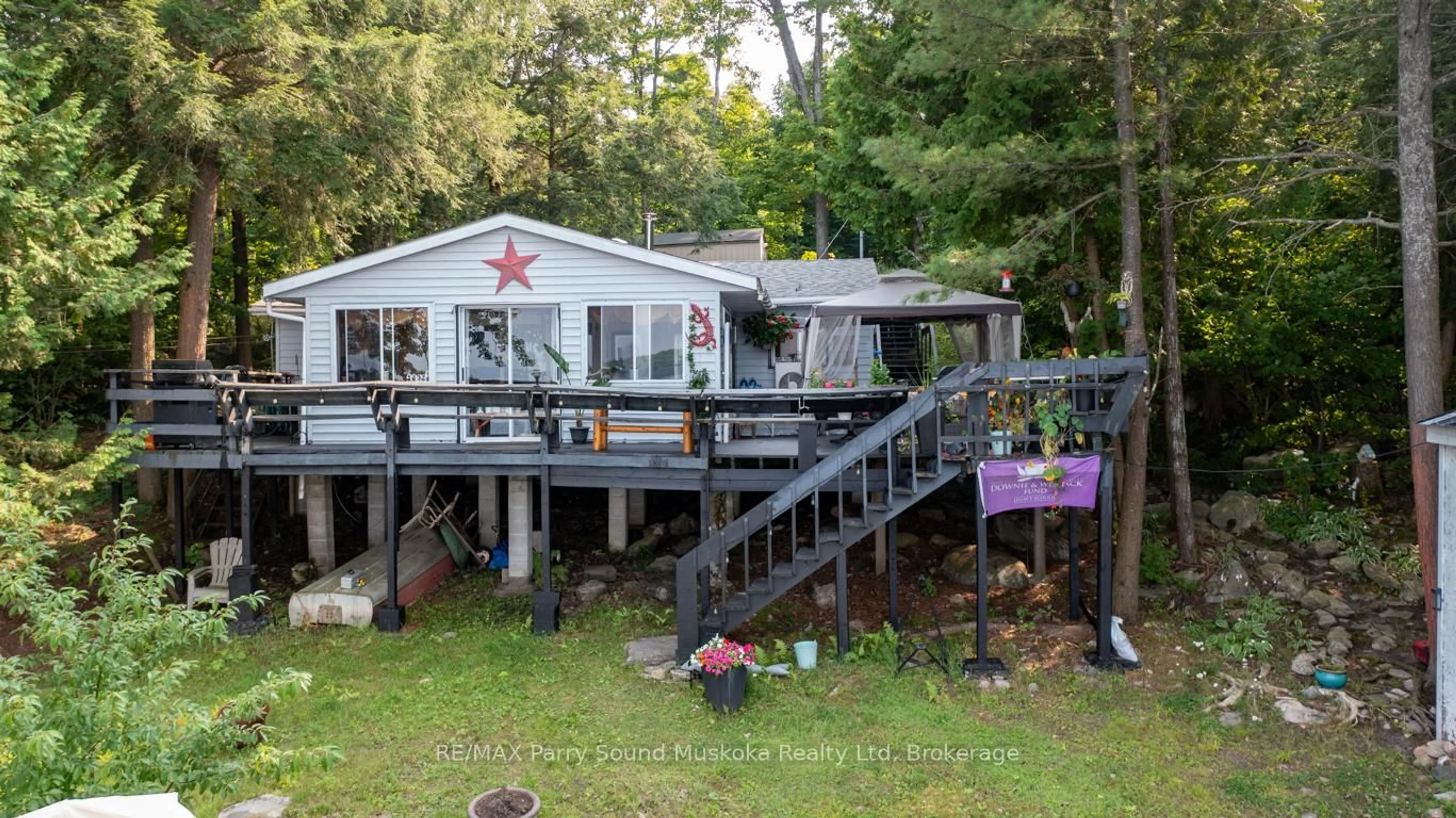 A pic from outside/outdoor area/front of a property/back of a property/a pic from drone, unknown for 808 Paradise Lane #Lot 206, Parry Sound Ontario P2A 2X4