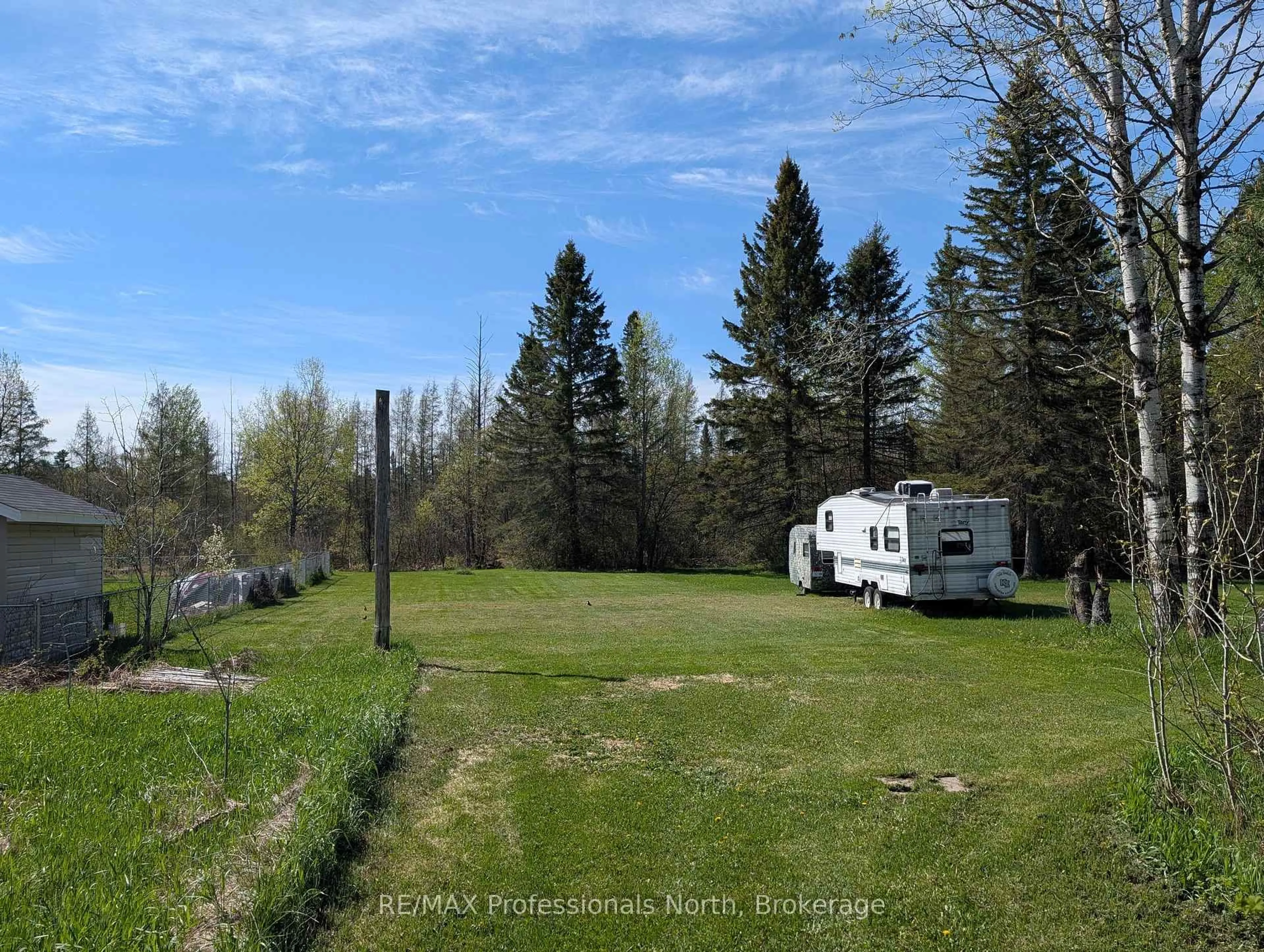 A pic from outside/outdoor area/front of a property/back of a property/a pic from drone, forest/trees view for 61 RIVERSIDE Ave, South River Ontario P0A 1X0