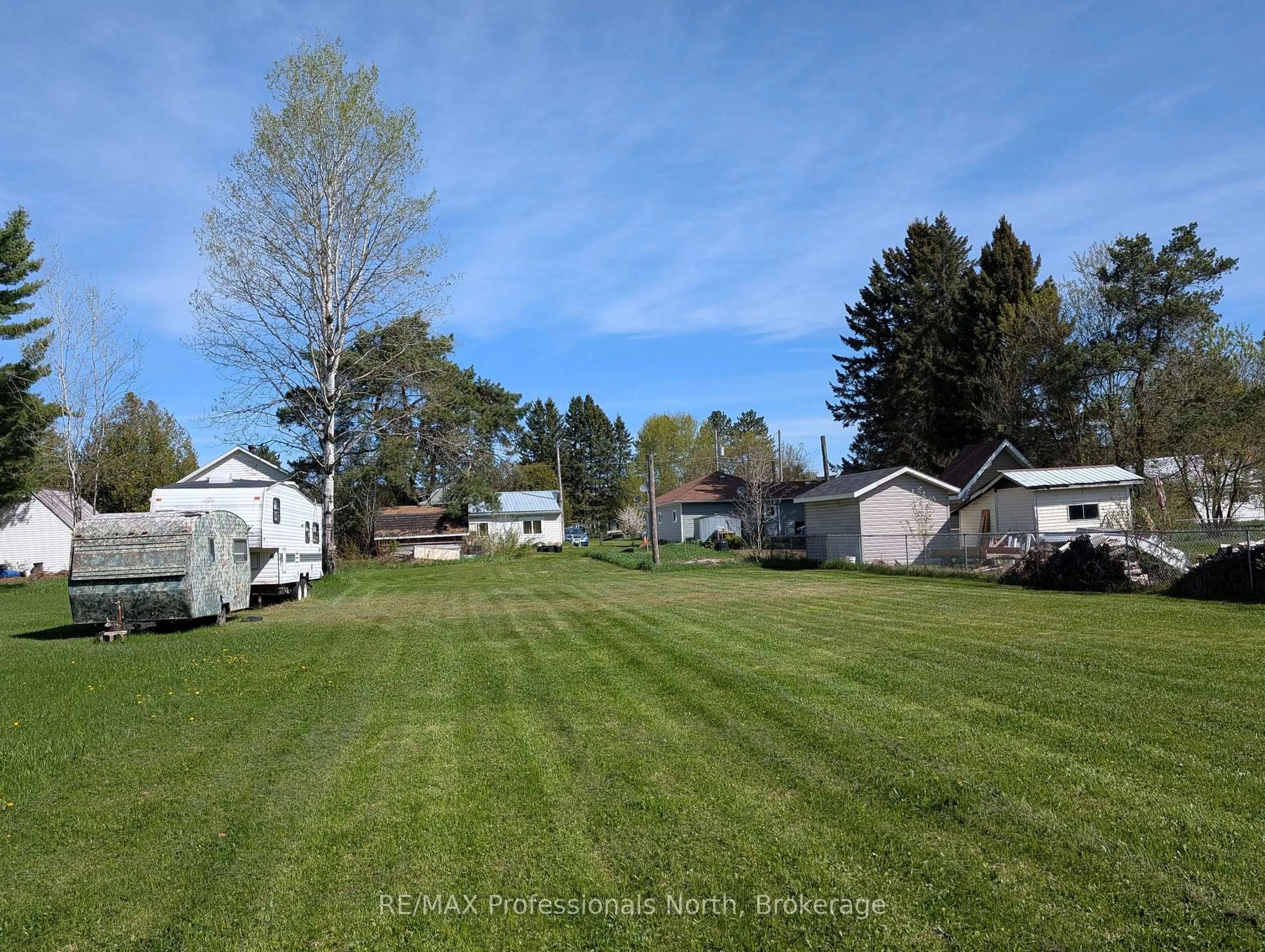 A pic from outside/outdoor area/front of a property/back of a property/a pic from drone, water/lake/river/ocean view for 61 RIVERSIDE Ave, South River Ontario P0A 1X0
