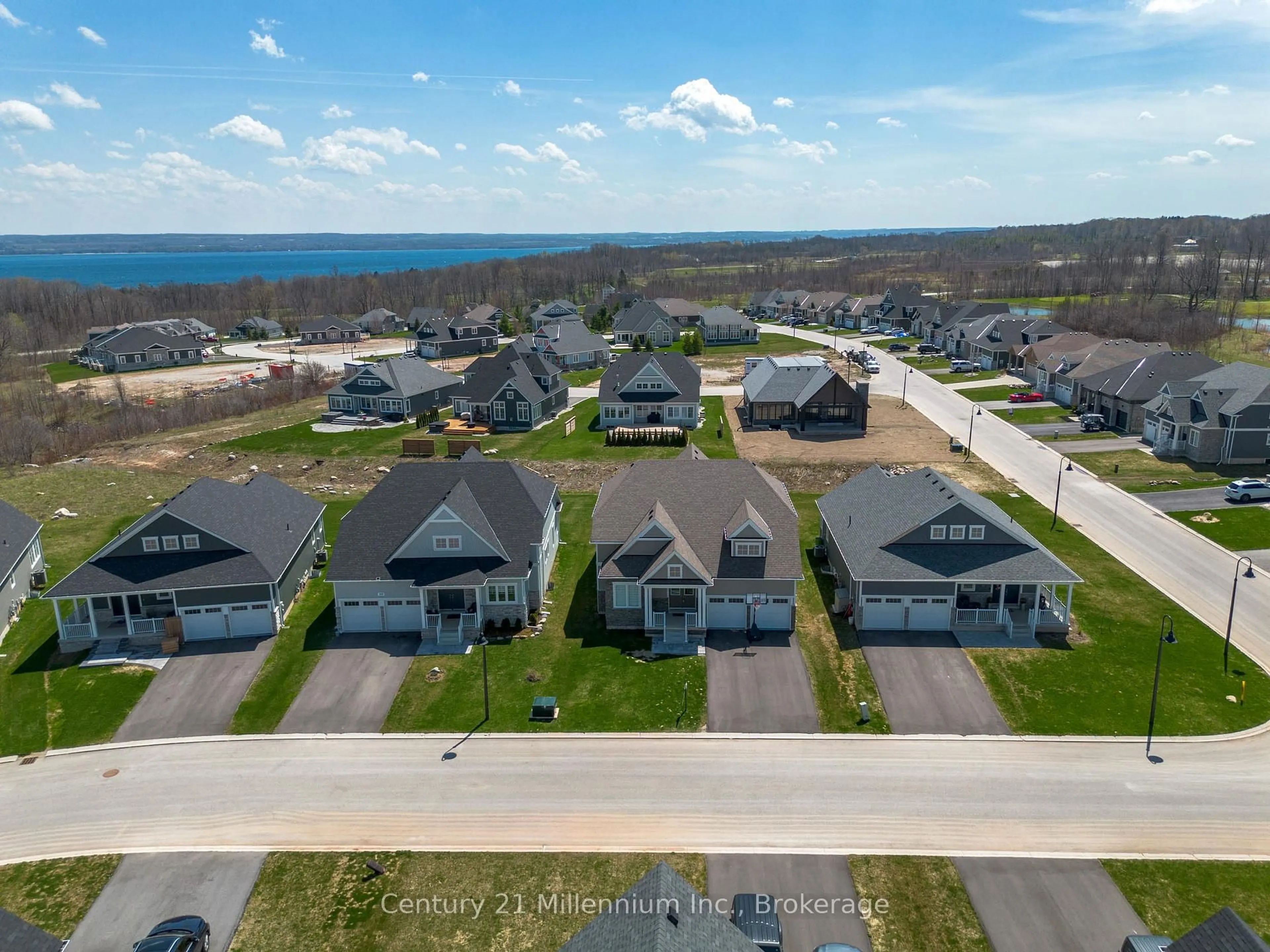 A pic from outside/outdoor area/front of a property/back of a property/a pic from drone, water/lake/river/ocean view for 103 Laurens Lane, Georgian Bluffs Ontario N0H 1S0