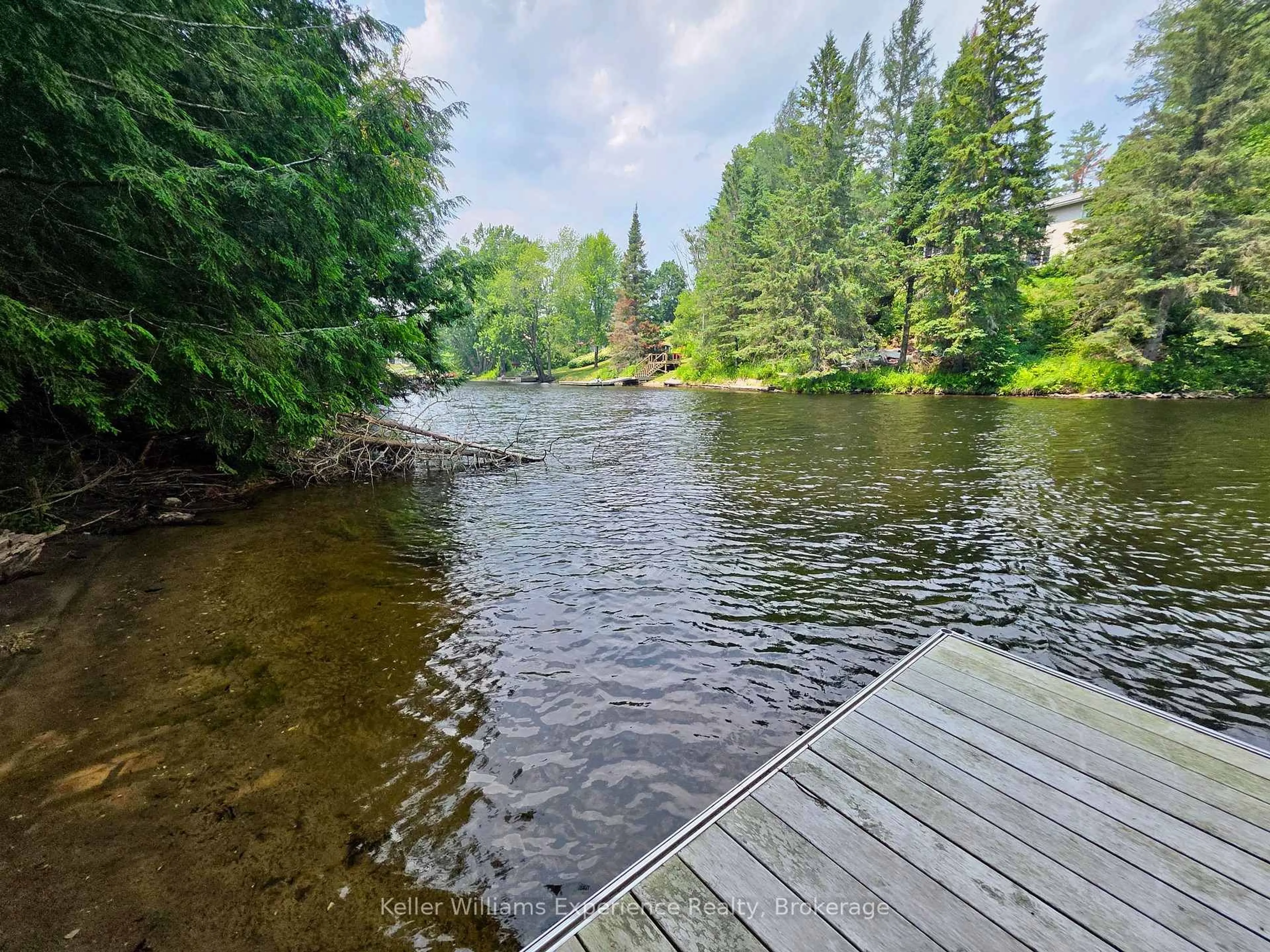 A pic from outside/outdoor area/front of a property/back of a property/a pic from drone, water/lake/river/ocean view for 49 Southbank Dr #10, Bracebridge Ontario P1L 1G2