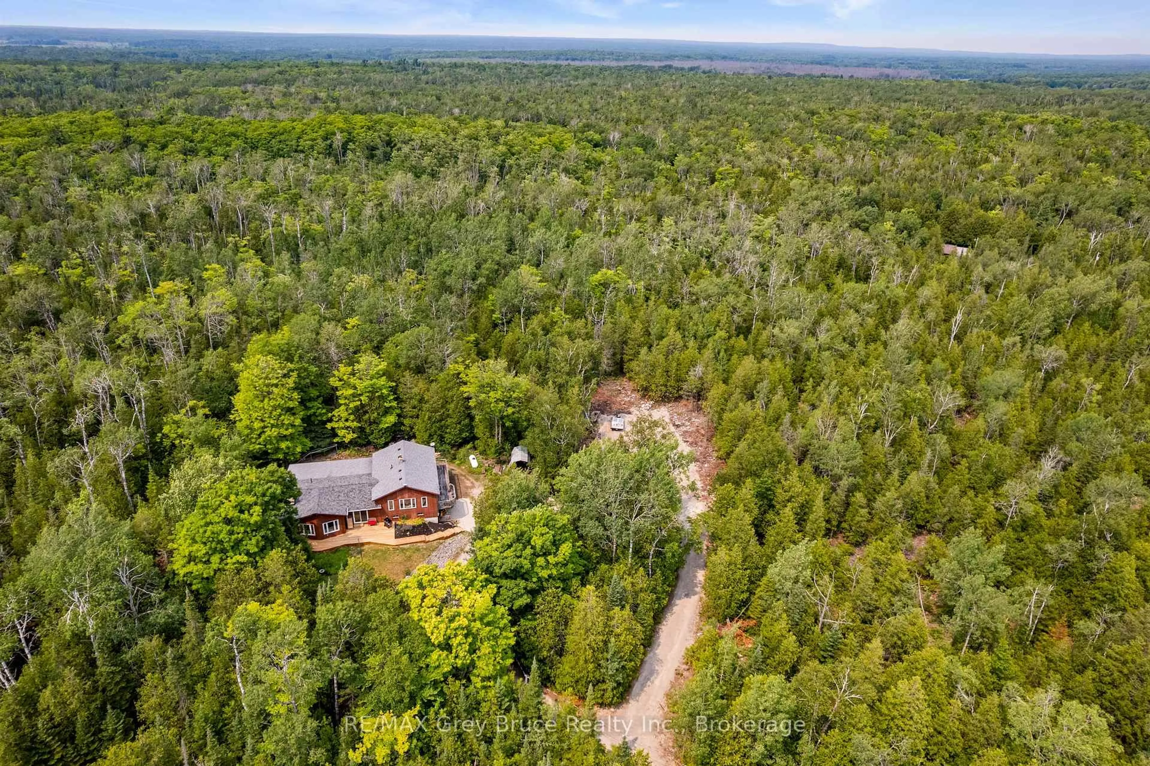 A pic from outside/outdoor area/front of a property/back of a property/a pic from drone, forest/trees view for 479 DYERS BAY Rd, Northern Bruce Peninsula Ontario N0H 1Z0