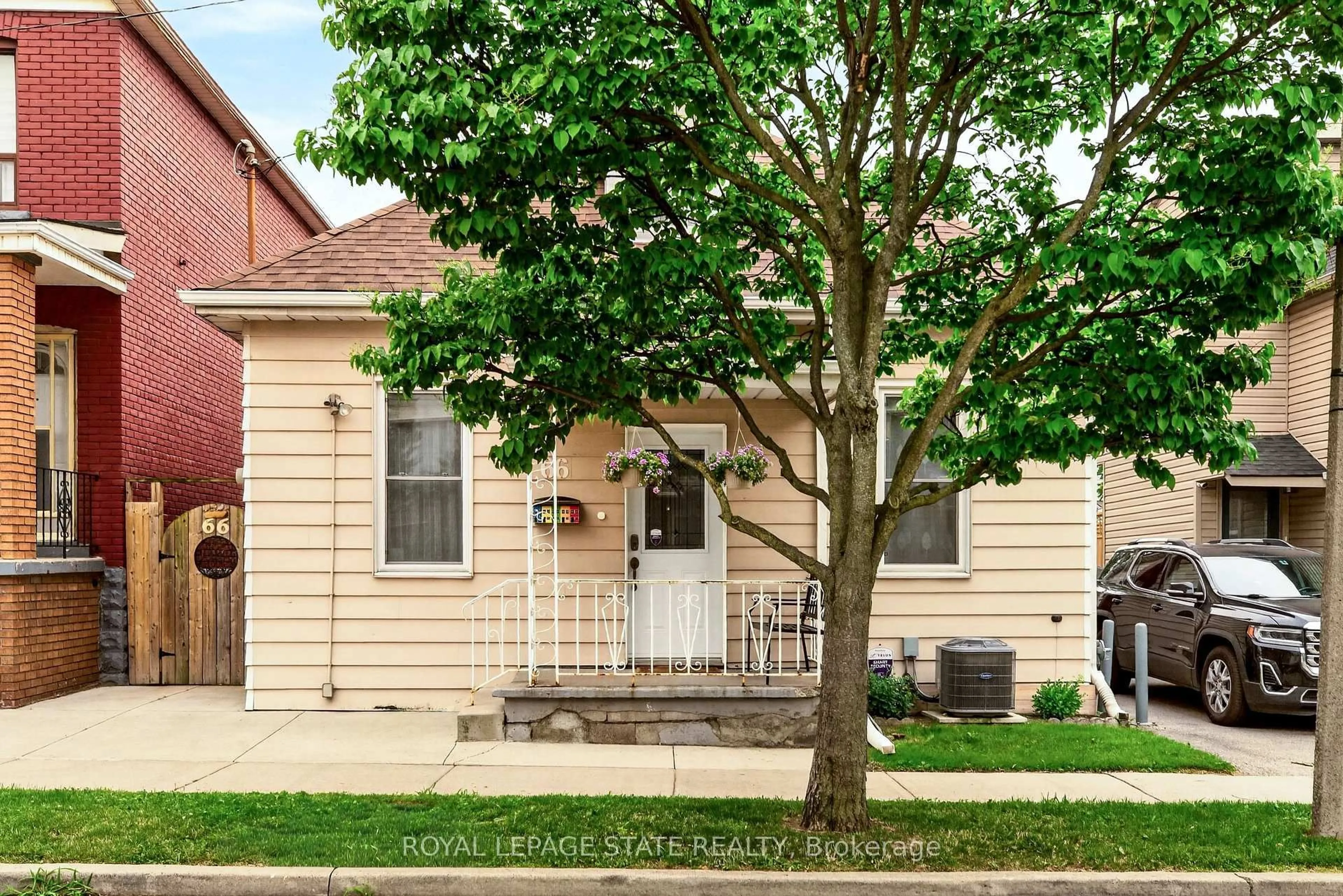 Home with brick exterior material, street for 66 Beechwood Ave, Hamilton Ontario L8L 2S4