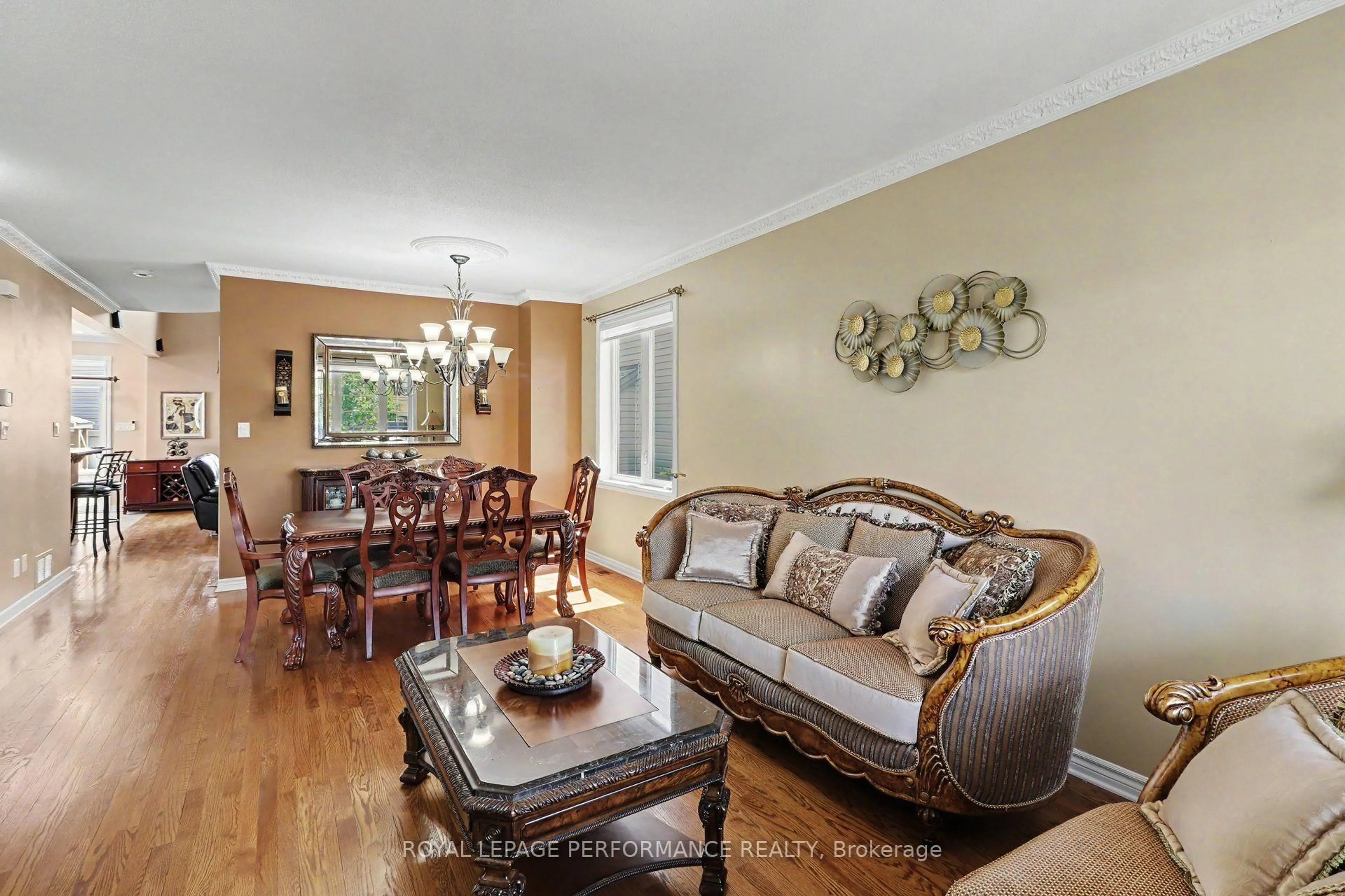 Living room with furniture, wood/laminate floor for 119 Felicity Cres, Orleans Ontario K1W 0C3