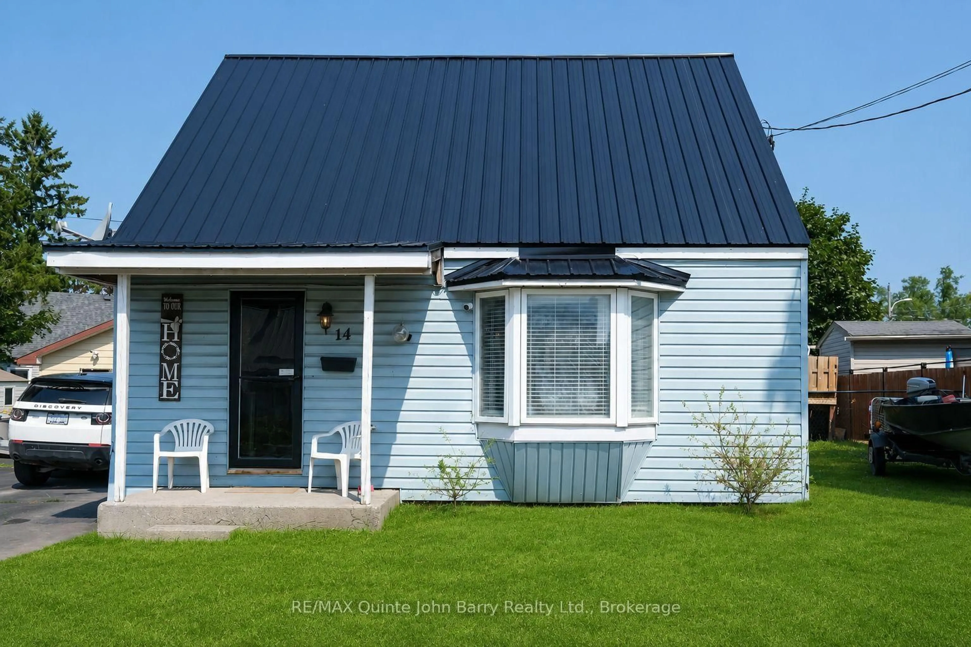 Home with vinyl exterior material, street for 14 Harriet St, Quinte West Ontario K8V 4L4