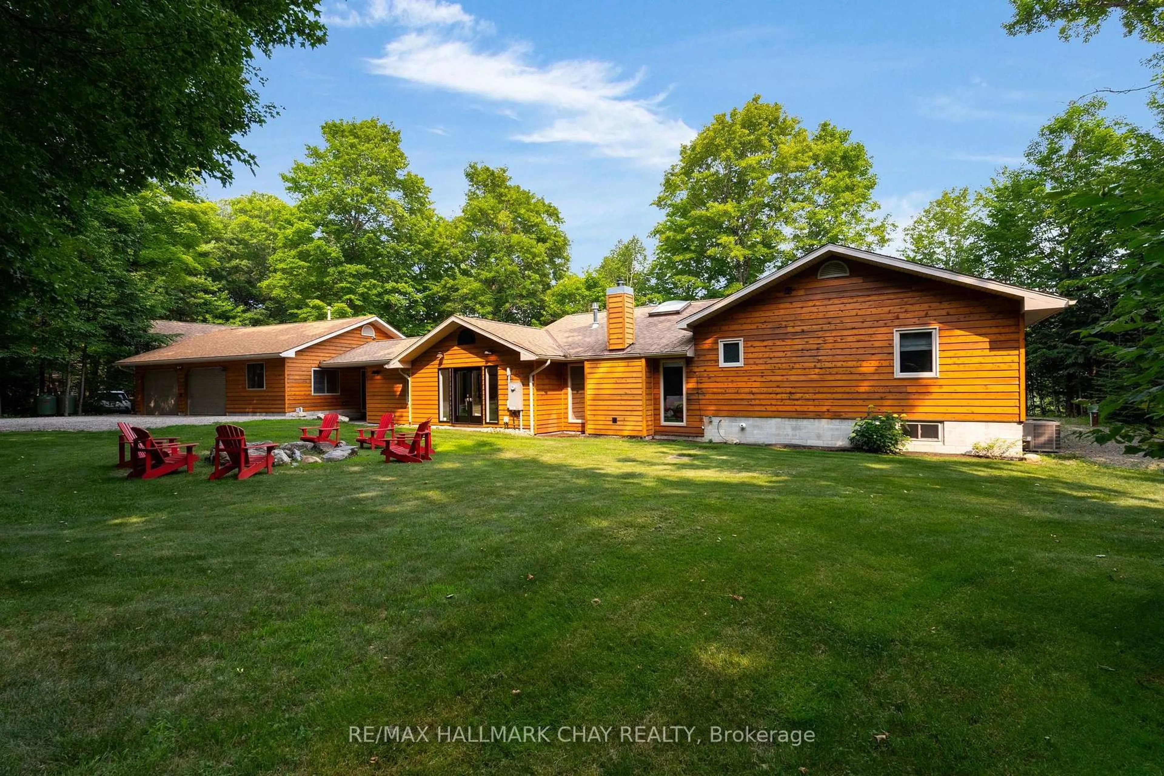 A pic from outside/outdoor area/front of a property/back of a property/a pic from drone, water/lake/river/ocean view for 1319 Wolf Circ, Algonquin Highlands Ontario P0A 1E0