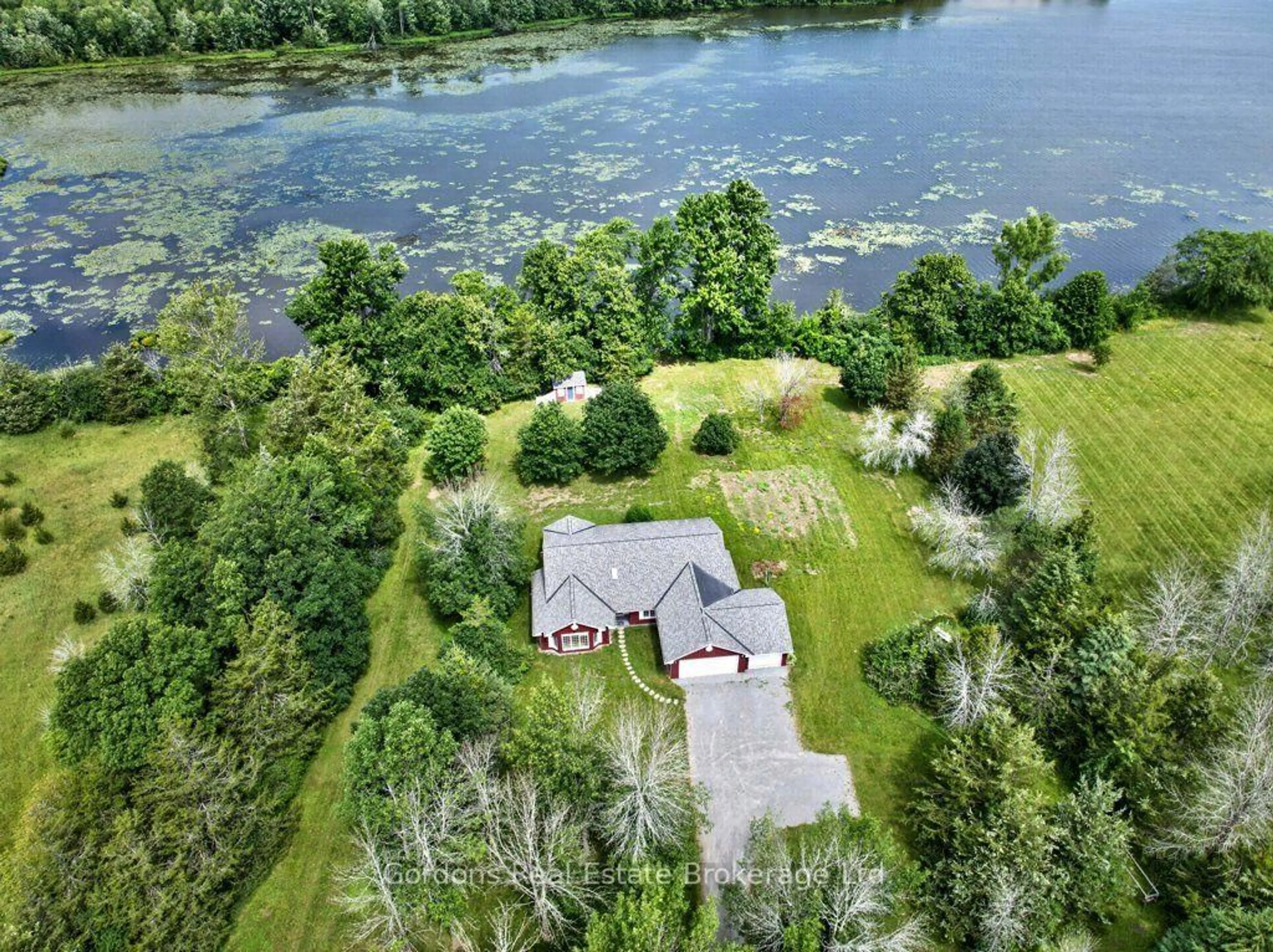 A pic from outside/outdoor area/front of a property/back of a property/a pic from drone, water/lake/river/ocean view for 225 Fish Lake Rd, Prince Edward County Ontario K0K 1W0