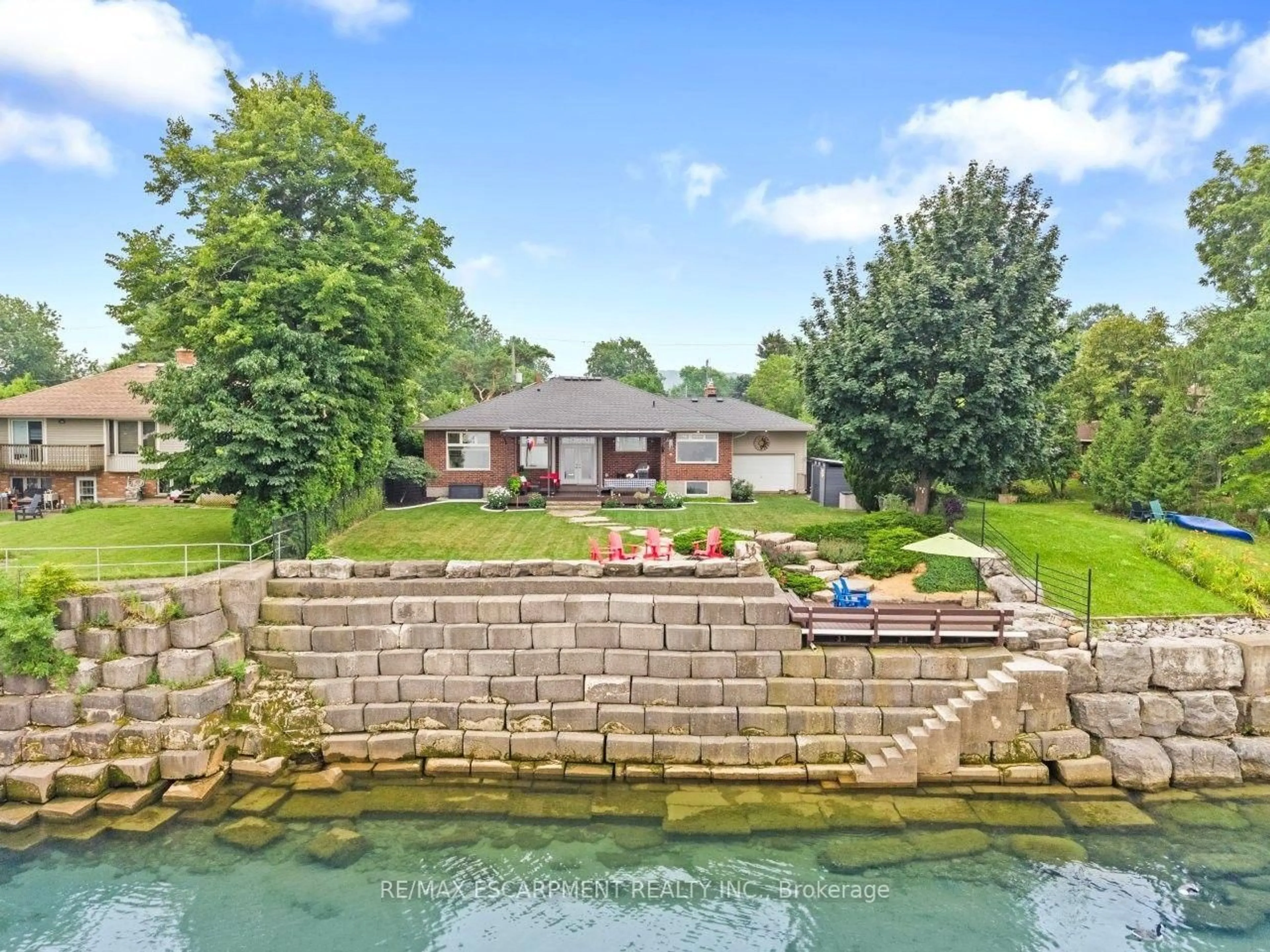 A pic from outside/outdoor area/front of a property/back of a property/a pic from drone, water/lake/river/ocean view for 42 Lakeside Dr, Grimsby Ontario L3M 2L2