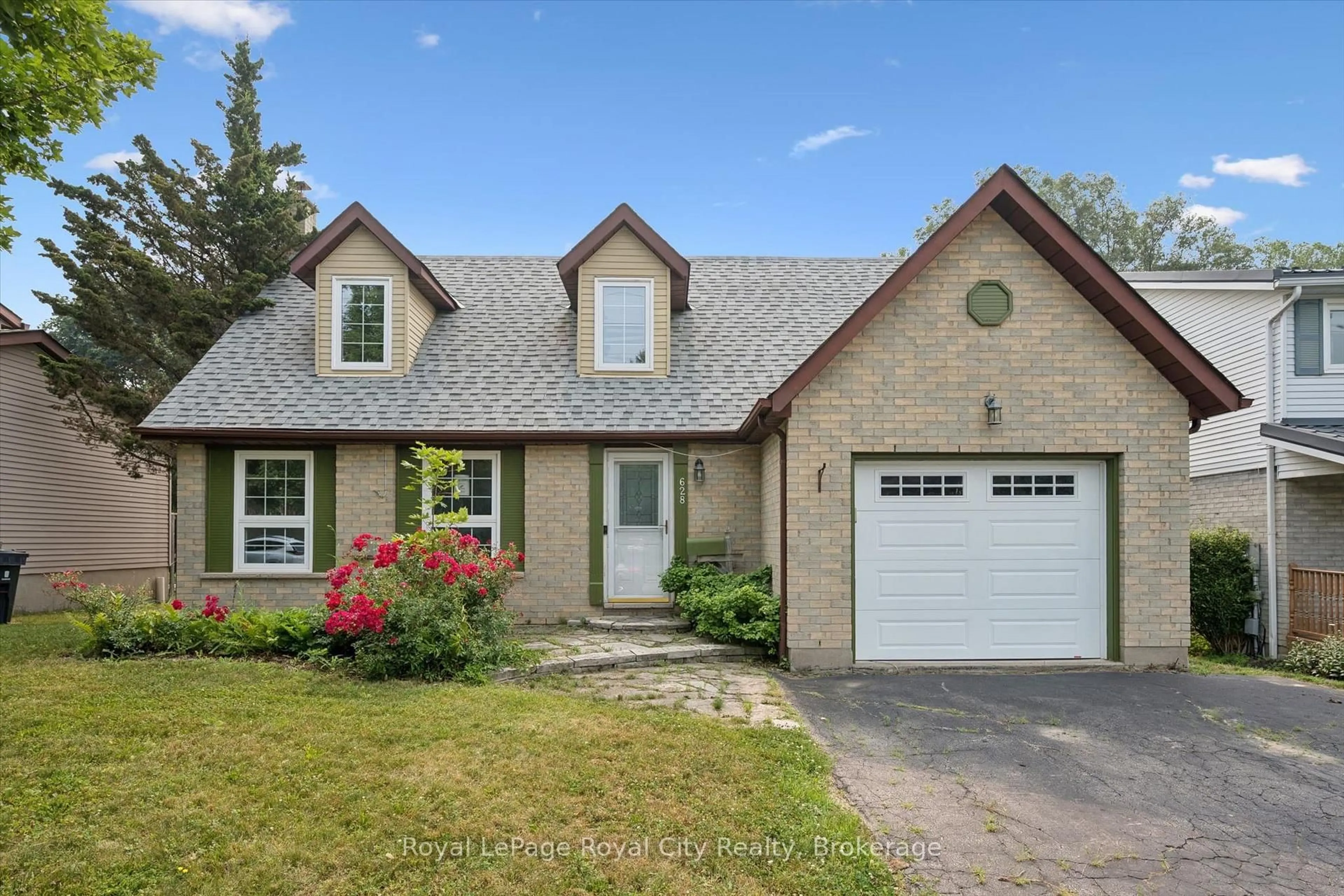 Home with brick exterior material, street for 628 Willow Rd, Guelph Ontario N1H 7M5