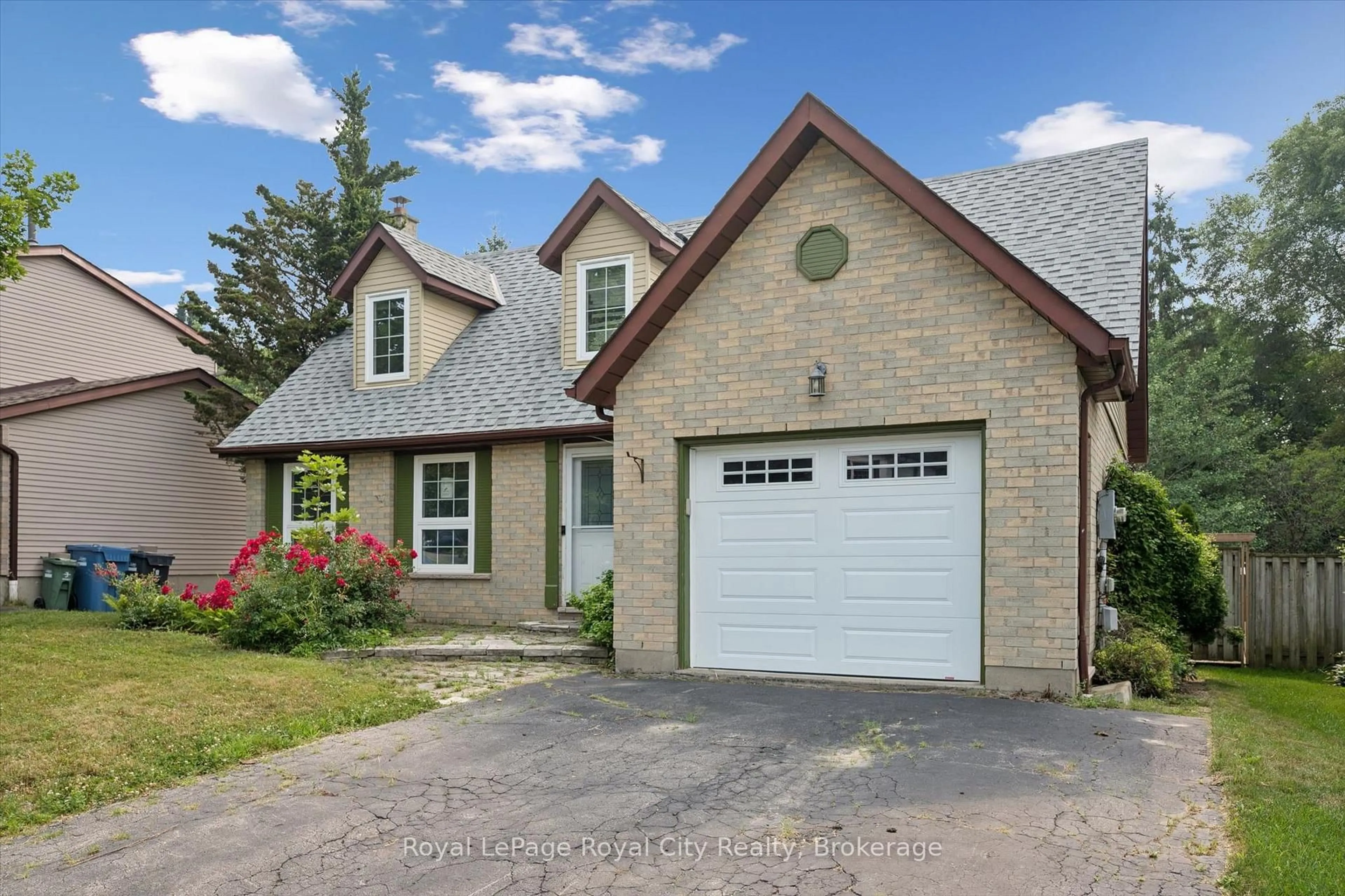 Home with brick exterior material, street for 628 Willow Rd, Guelph Ontario N1H 7M5
