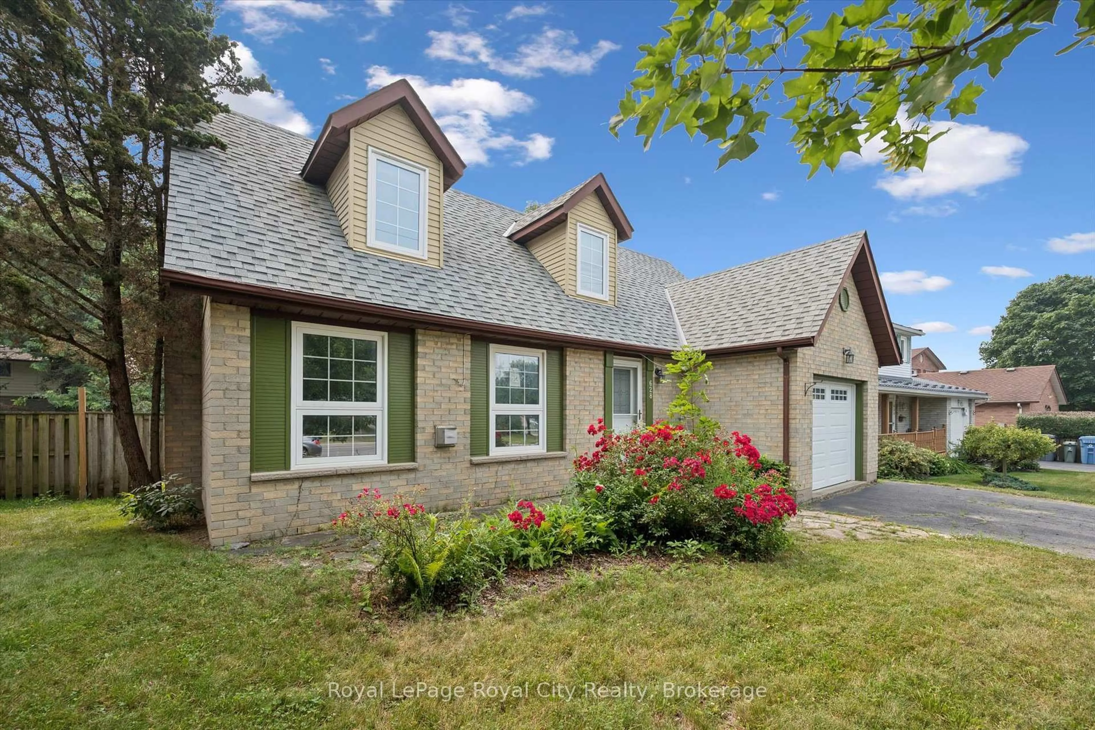 Home with brick exterior material, street for 628 Willow Rd, Guelph Ontario N1H 7M5