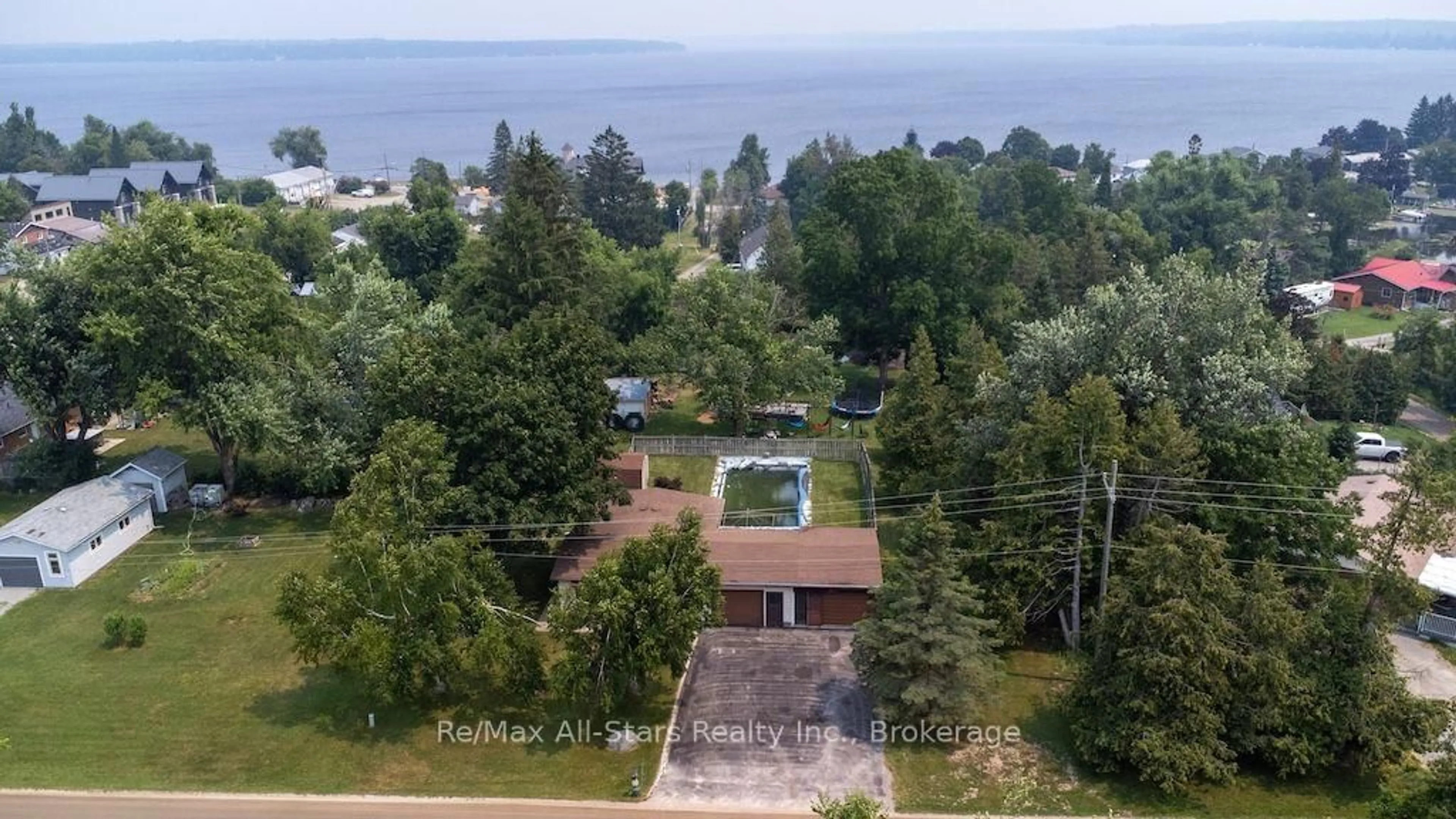 A pic from outside/outdoor area/front of a property/back of a property/a pic from drone, water/lake/river/ocean view for 9 Jones Ave, Kawartha Lakes Ontario K0M 1G0