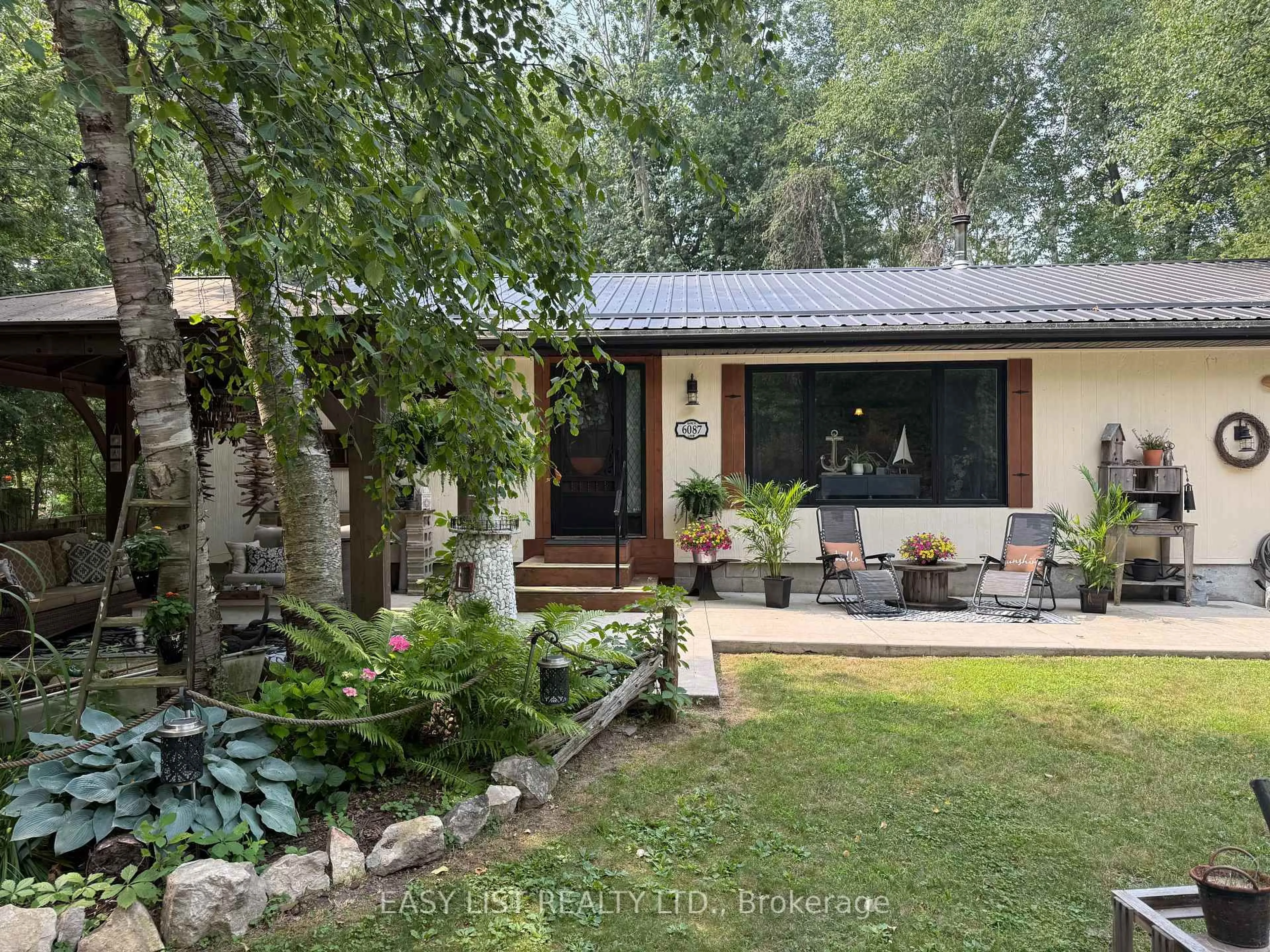 A pic from outside/outdoor area/front of a property/back of a property/a pic from drone, forest/trees view for 6087 Birch Lane, Lambton Shores Ontario N0N 1J1
