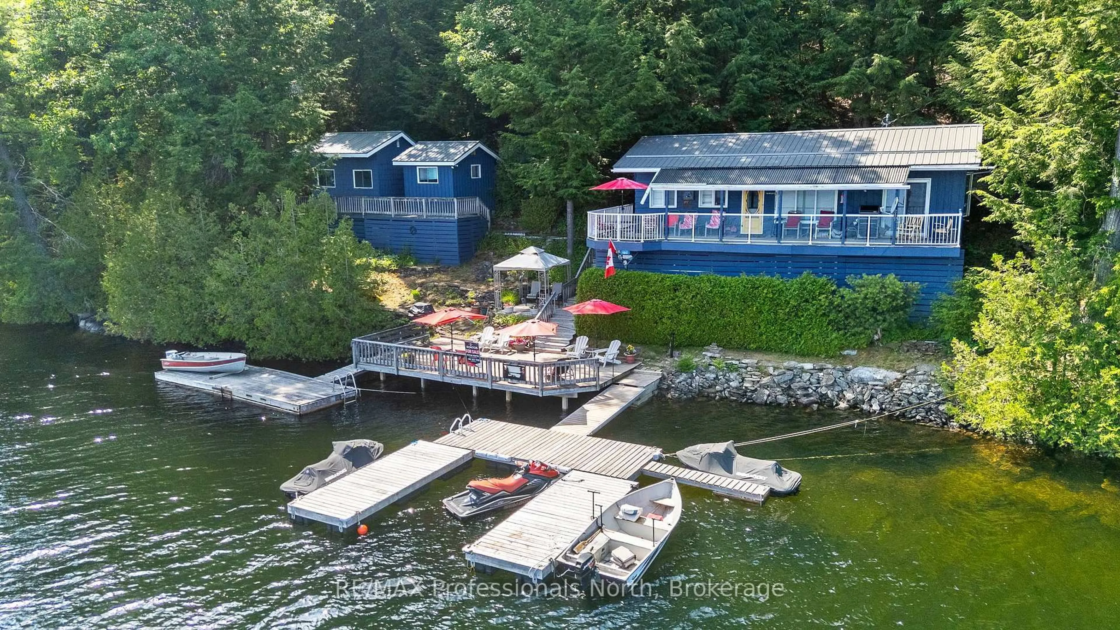 A pic from outside/outdoor area/front of a property/back of a property/a pic from drone, water/lake/river/ocean view for 11047 Little Hawk West Shore WAO, Algonquin Highlands Ontario K0M 1S0