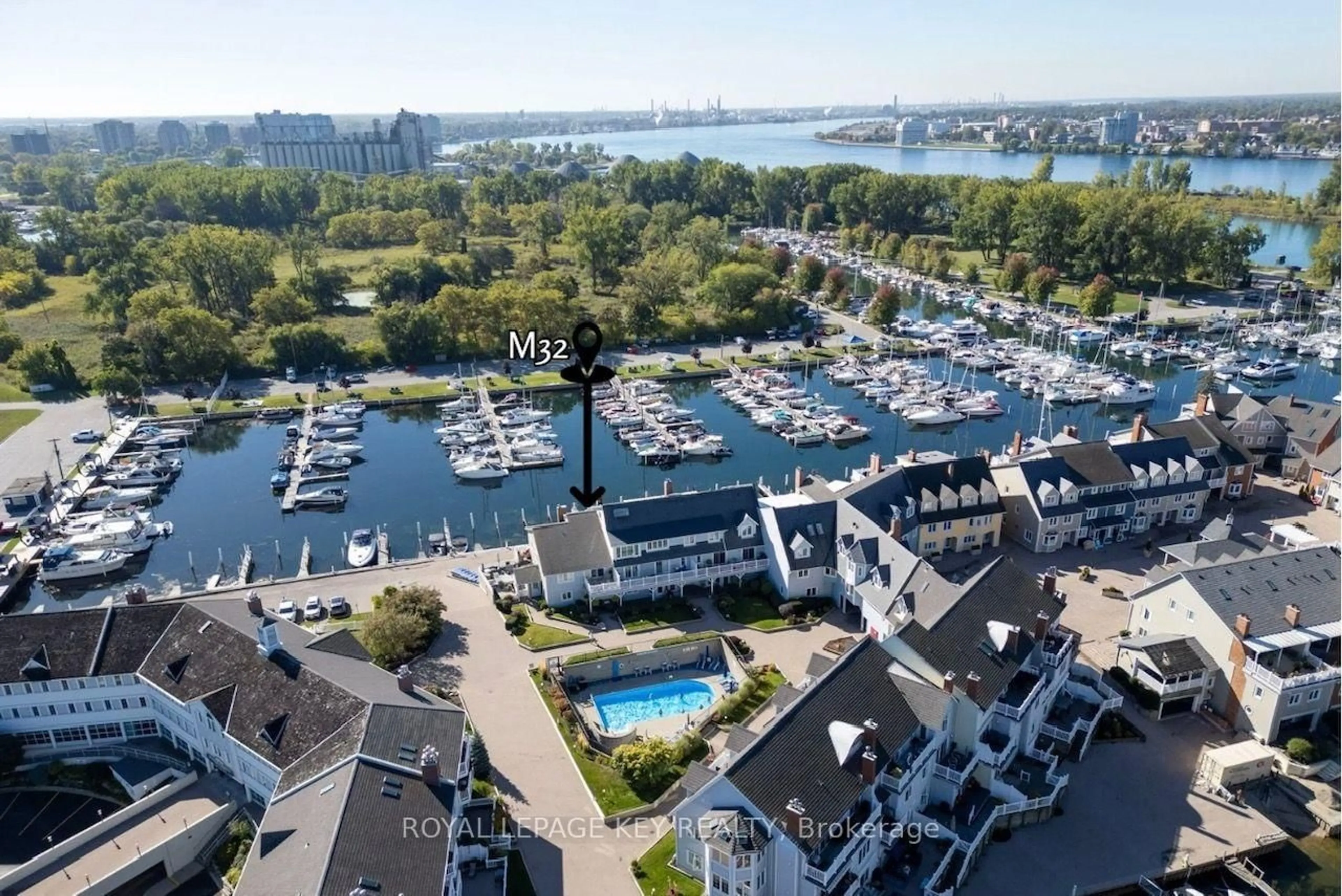 A pic from outside/outdoor area/front of a property/back of a property/a pic from drone, water/lake/river/ocean view for 1510 Venetian Blvd #M32, Point Edward Ontario N7T 7X8