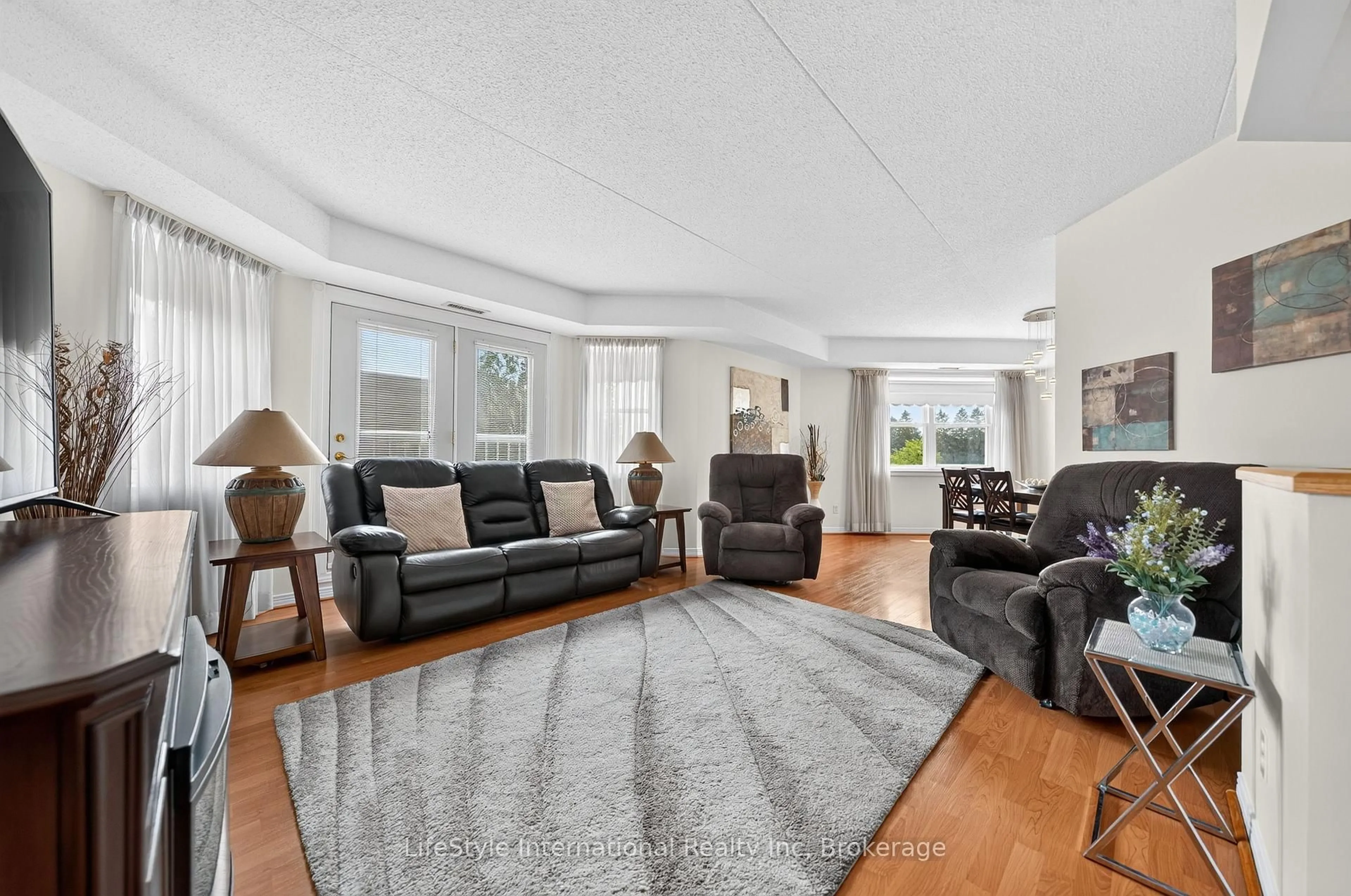 Living room with furniture, unknown for 208 Silvercreek Pkwy #210, Guelph Ontario N1H 8H2