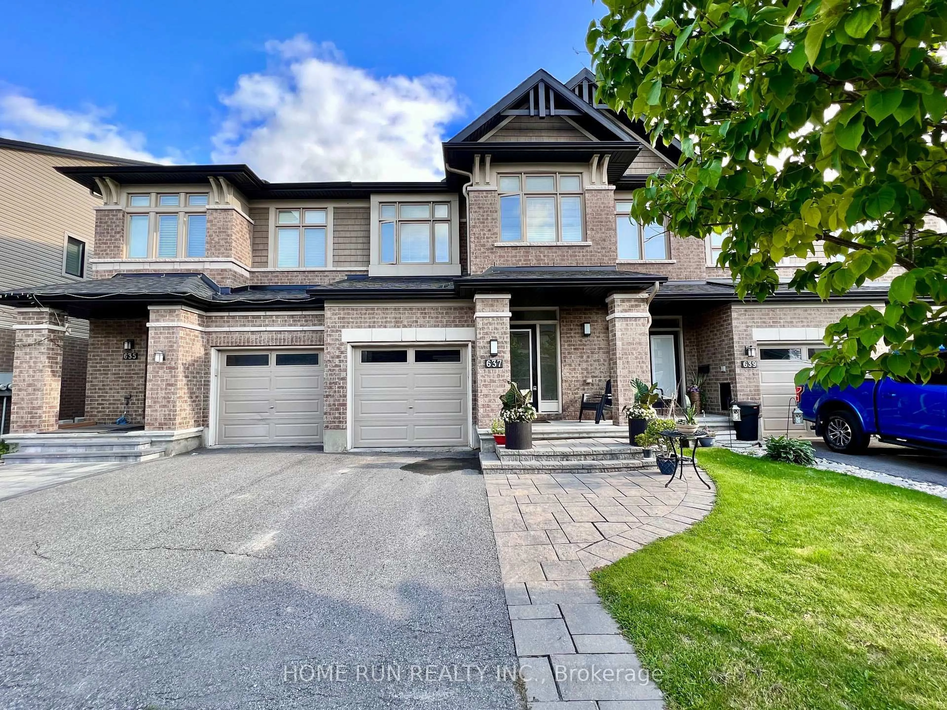 Home with brick exterior material, street for 637 Tennant Way, Ottawa Ontario K4M 0C7
