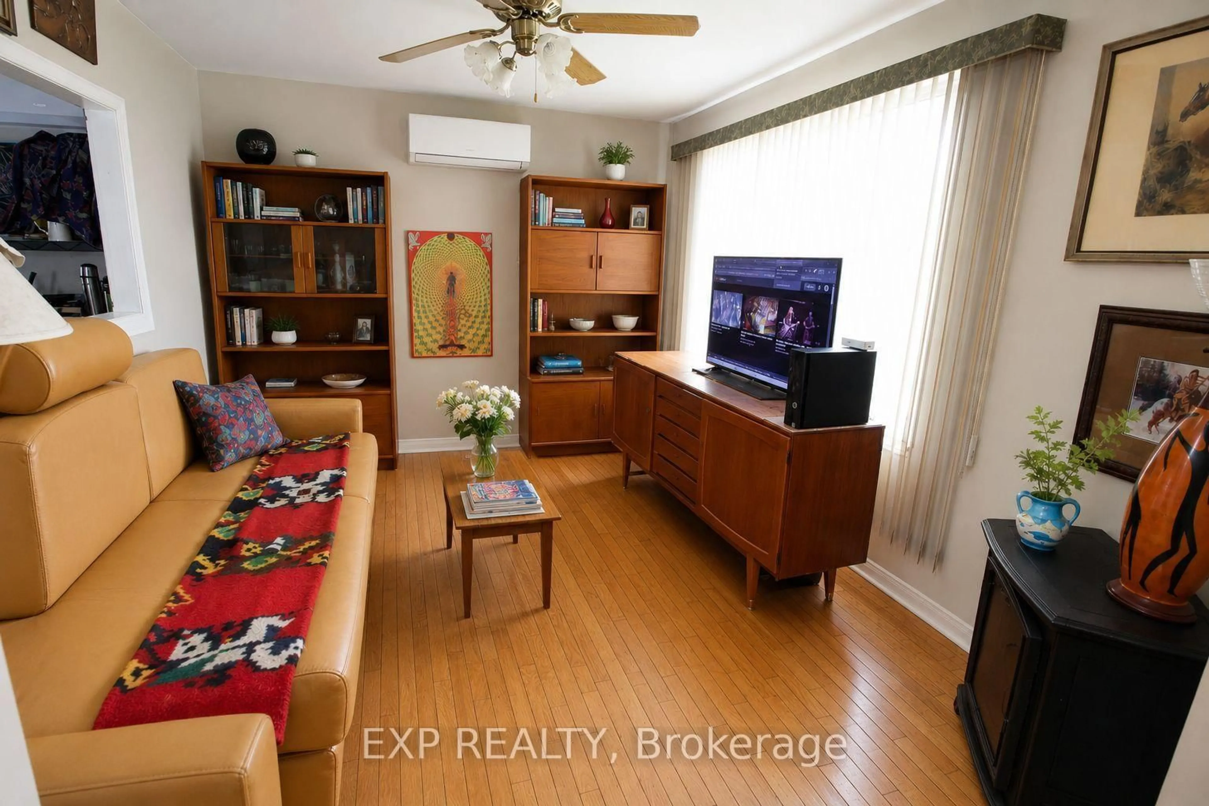 Living room with furniture, wood/laminate floor for 4166 County 34 Rd, South Glengarry Ontario K0C 1L0
