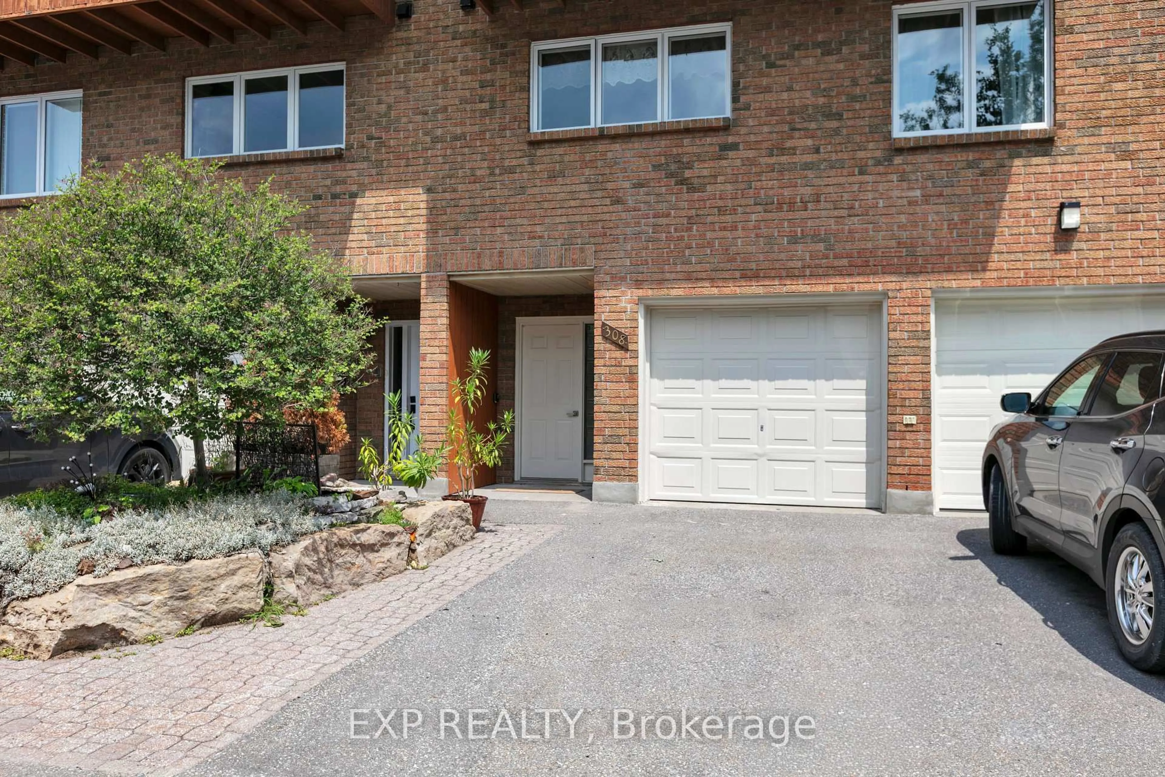 Home with brick exterior material, street for 308 Stratas Crt #24, Kanata Ontario K2L 3K6