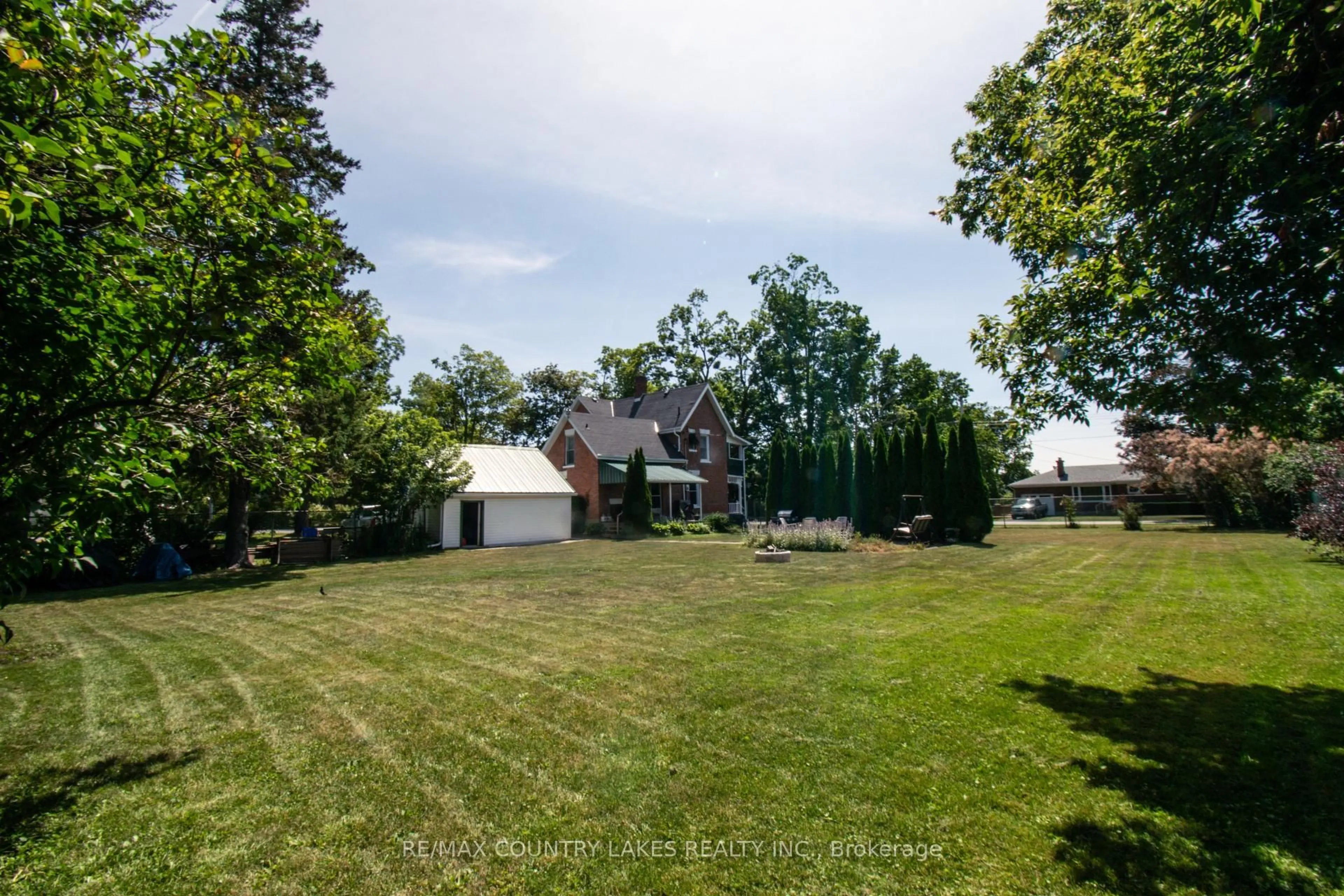 A pic from outside/outdoor area/front of a property/back of a property/a pic from drone, unknown for 100 Nappadale St, Kawartha Lakes Ontario K0M 2T0